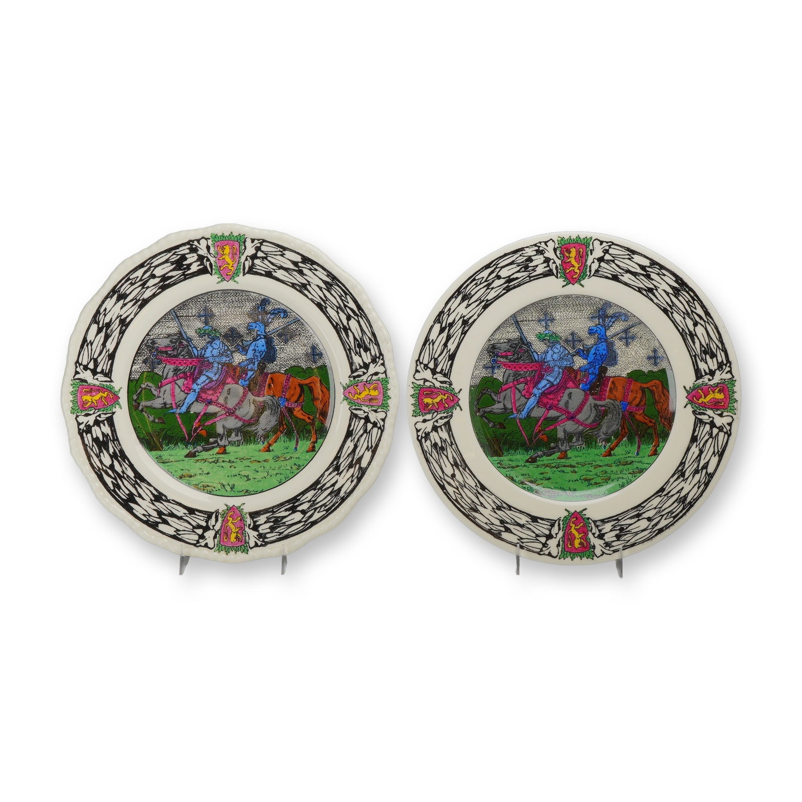 2pc Royal Doulton Seriesware King Arthurs Knights Plates: This pair of Royal Doulton earthenware dinner plates is from the King Arthurs Knights seriesware line, pattern number D2961. The central well of each plate is decorated with a transfer-printed medieva