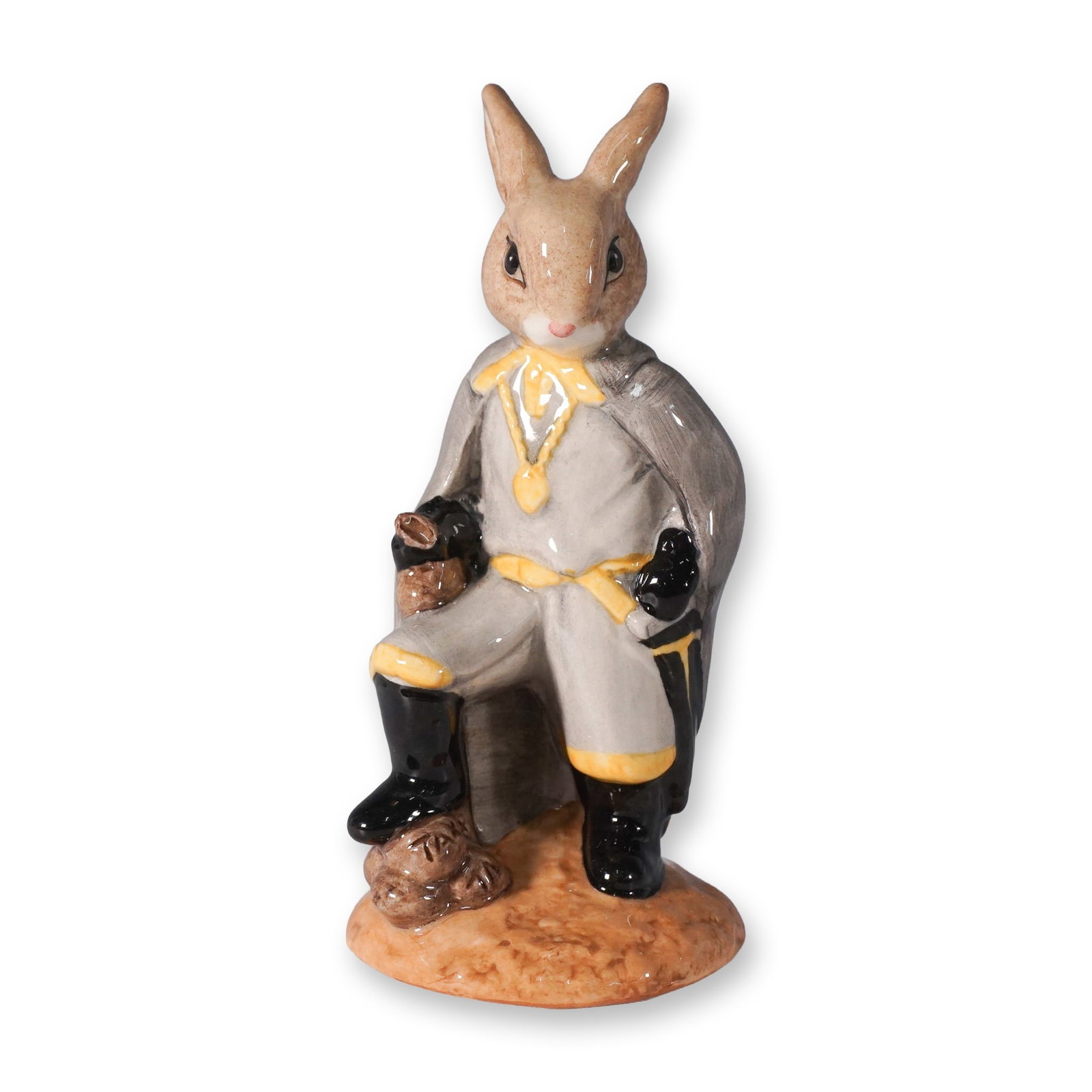 Royal Doulton Bunnykins Sheriff of Nottingham DB265 Figurine: This Royal Doulton Bunnykins figurine, titled Sheriff of Nottingham (DB265), was designed by Martyn Alcock and issued between 2002 and 2003. The hand-painted china piece features the Sheriff in a grey
