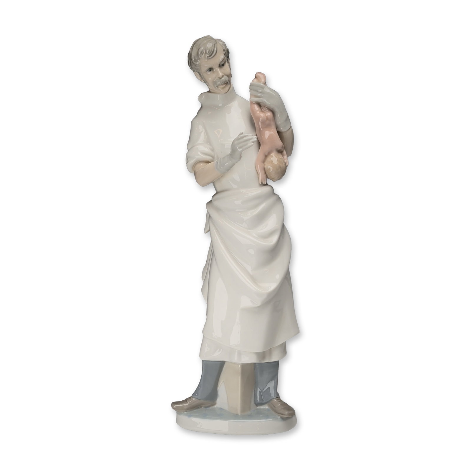 Lladro Porcelain Figurine Obstetrician 4763: Spanish Lladro glazed porcelain figurine titled Obstetrician, model number 4763, designed by sculptor Salvador Furio. The piece depicts a male medical professional with gray hair and a mustache, dress