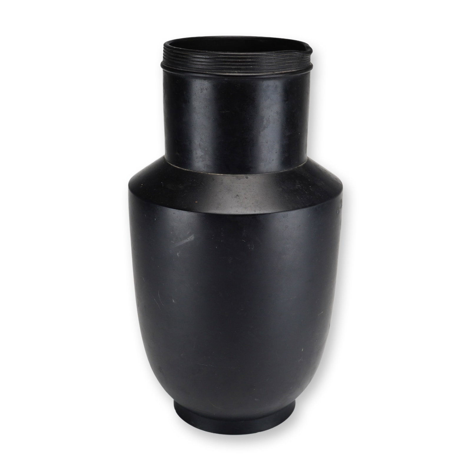 Wedgwood Black Basalt Matte Stoneware Spouted Vase: A Wedgwood black basalt stoneware spoutedvase, featuring a characteristic matte black unglazed finish. The vessel is designed with an ovoid body and a sharp, sloped shoulder that leads to a straight c