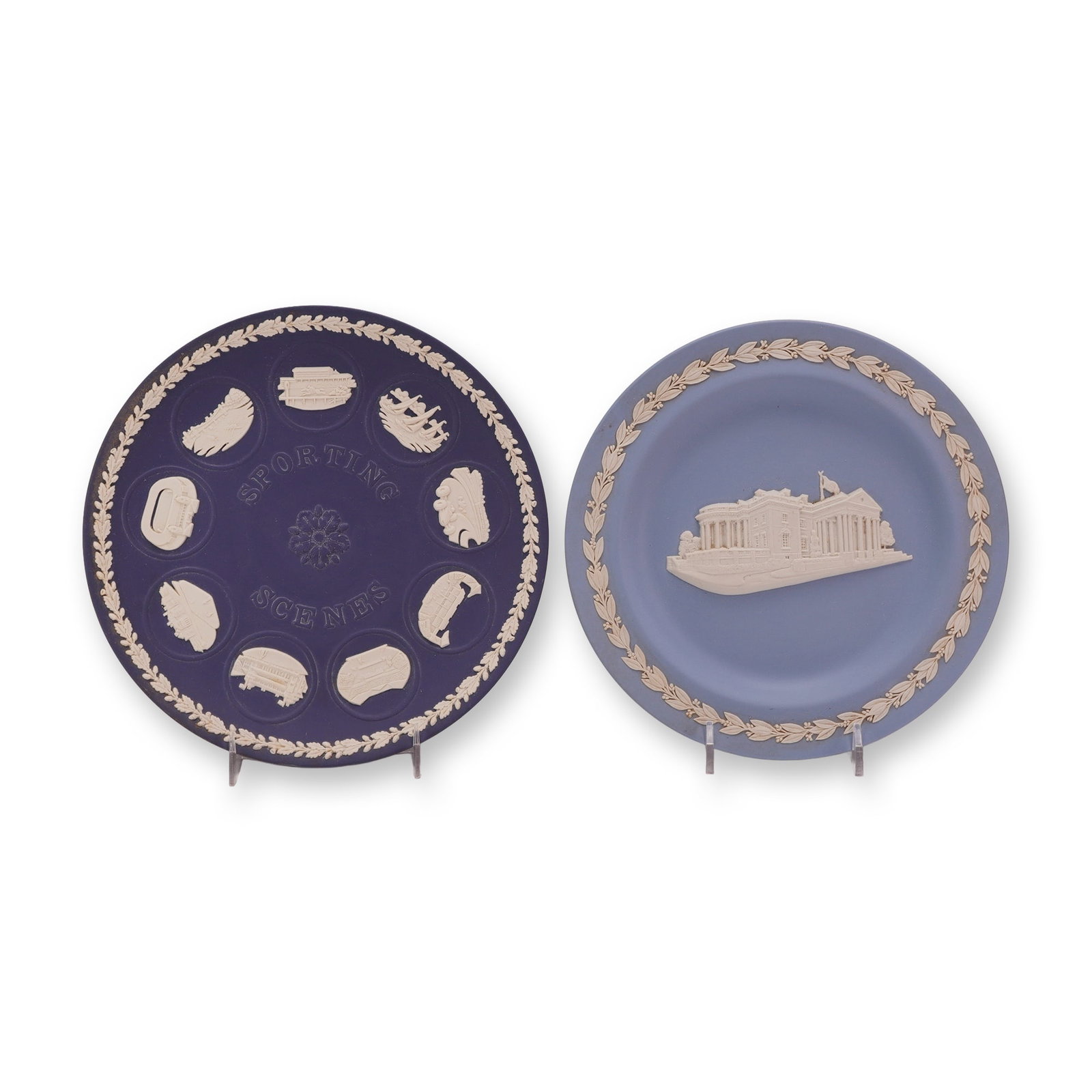 Two Wedgwood Jasperware Commemorative Plates, Sporting Scenes and 250yrs Innovation & Artistry: This lot consists of two circular Wedgwood Jasperware stoneware plates featuring hand-applied white sprigged bas-relief decoration. The first plate is executed in a dark Portland Blue ground and featu
