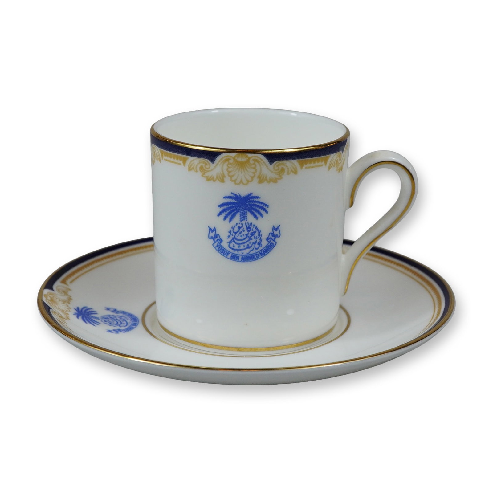 Wedgwood Bone China Demitasse Cup and Saucer, Cavendish Pattern: A Wedgwood fine bone china demitasse cup and saucer set in the Cavendish pattern, reference number R4680. Each piece is crafted with a white ground featuring a navy blue border accented by gold-tone n