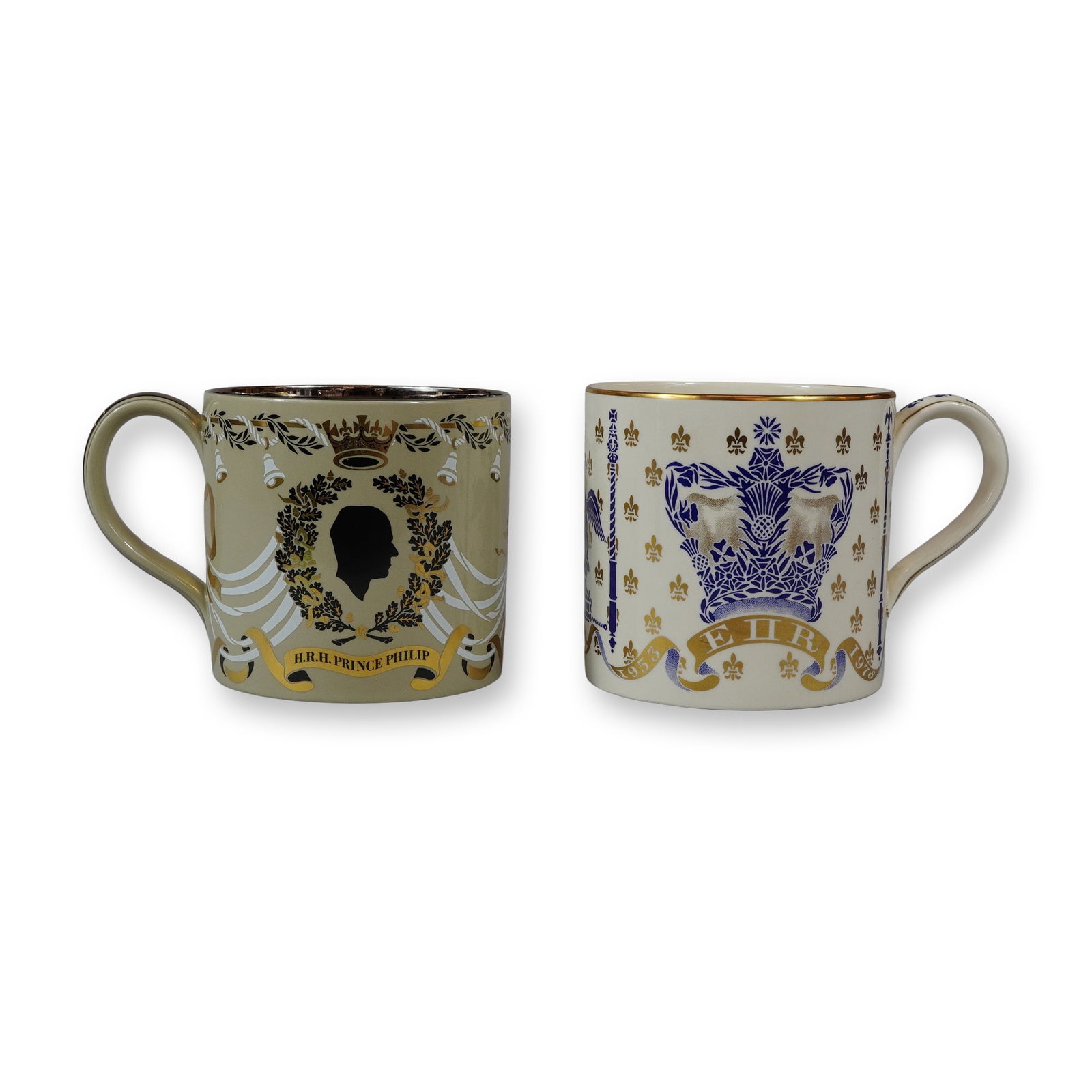 2pc Wedgwood by Richard Guyatt Queen Elizabeth II Commemorative Mugs: A pair of glazed ceramic commemorative mugs designed by Richard Guyatt for Wedgwood. One mug, featuring a tan glaze with gold and black accents, commemorates the twenty-fifth wedding anniversary of Qu