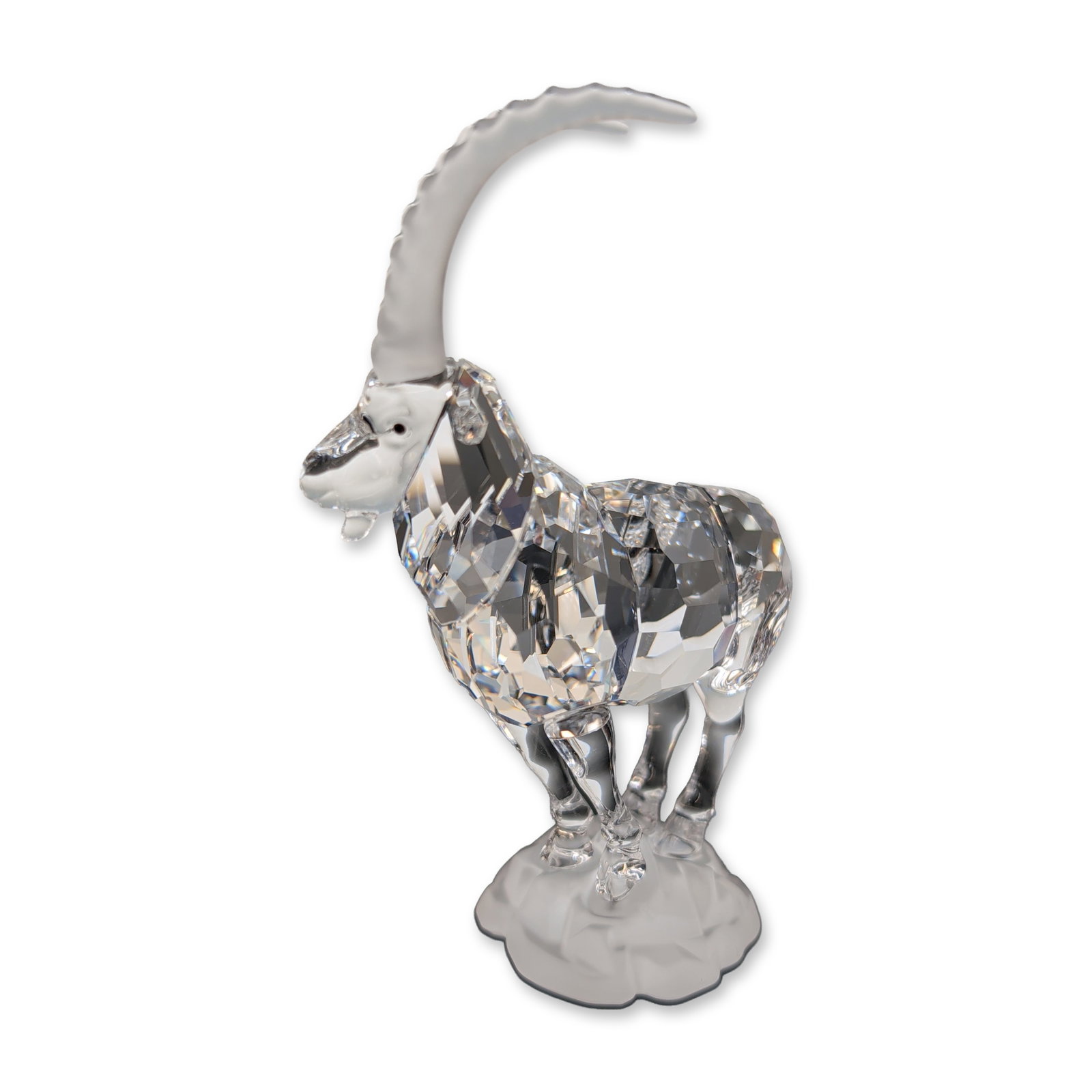 Swarovski Endangered Species Crystal Figurine, Ibex: Swarovski Alpine Ibex figurine from the Endangered Species collection, crafted in lead crystal. The figure features a faceted clear crystal body and legs, contrasted with a frosted crystal for the lar