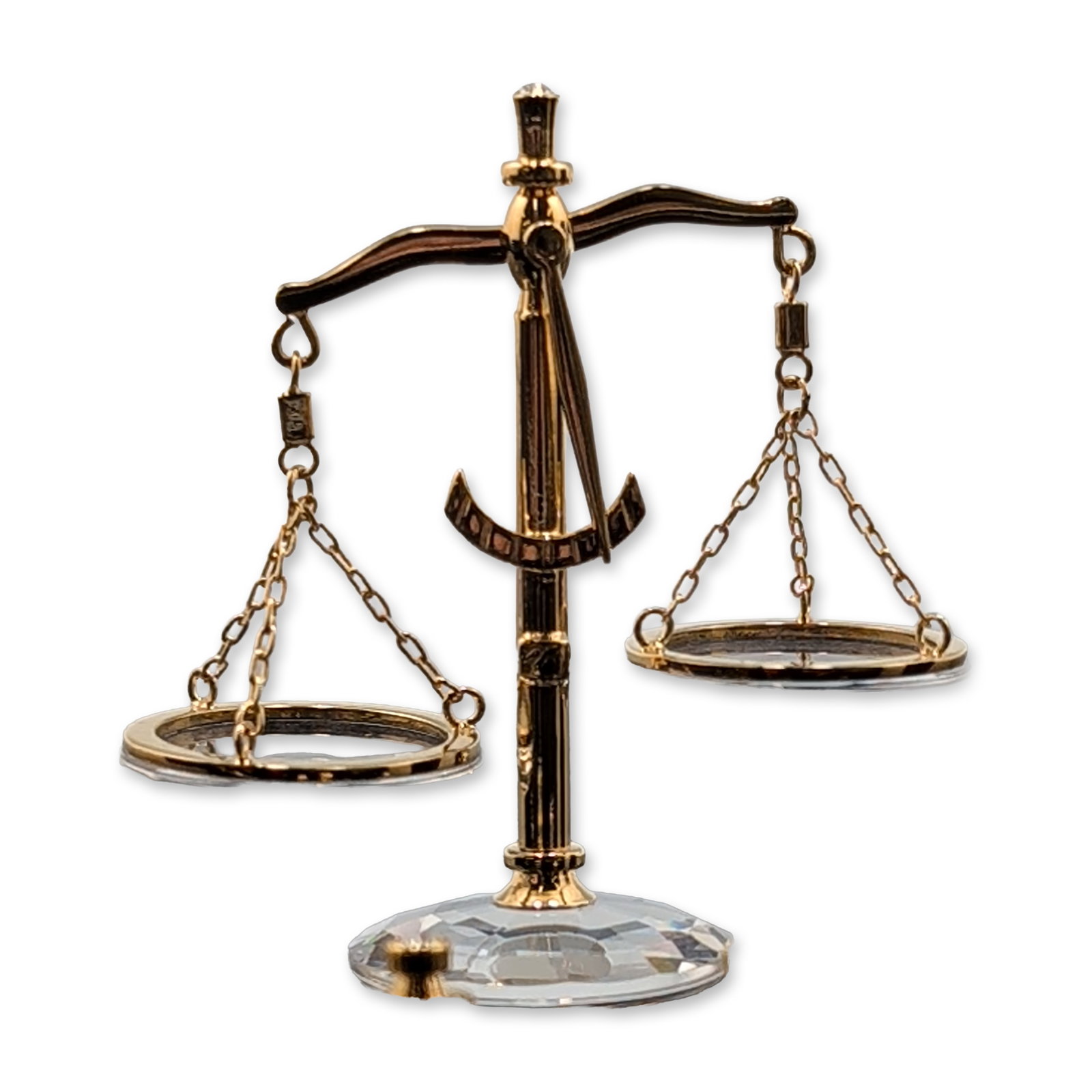 Swarovski Crystal Memories, Balance Scale Gold-Tone Miniature: Swarovski miniature decorative balance scale in gold-tone metal and faceted clear crystal. The piece features a central stem intended for mounting on a circular crystal base, with two crystal pans sus