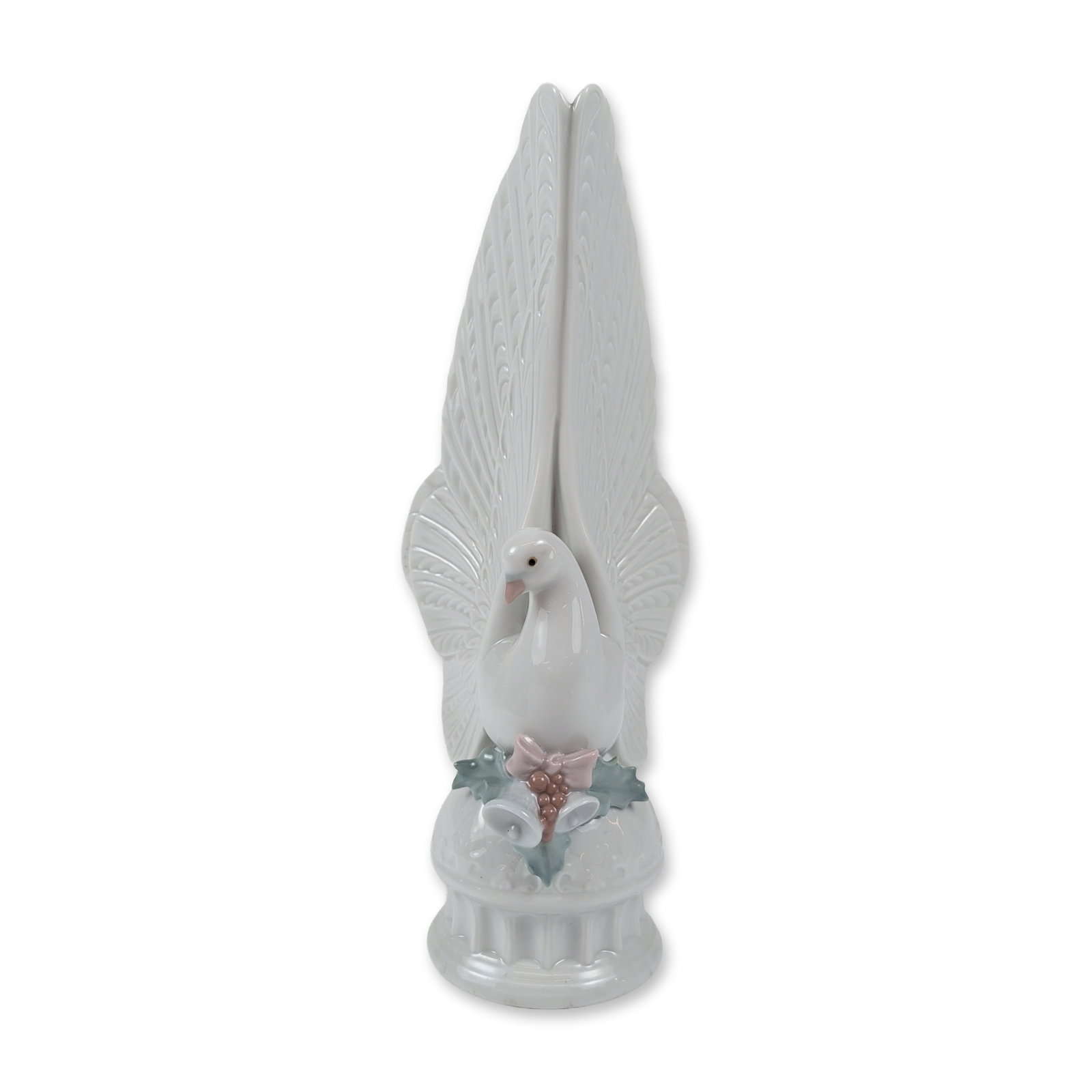 Lladro Spanish Porcelain Message of Peace Figurine: Lladro, Spain. Glazed porcelain figurine titled Message of Peace, model number 6587, depicting a stylized white dove with tall, swept wings. The bird is perched upon a pedestal base decorated with app