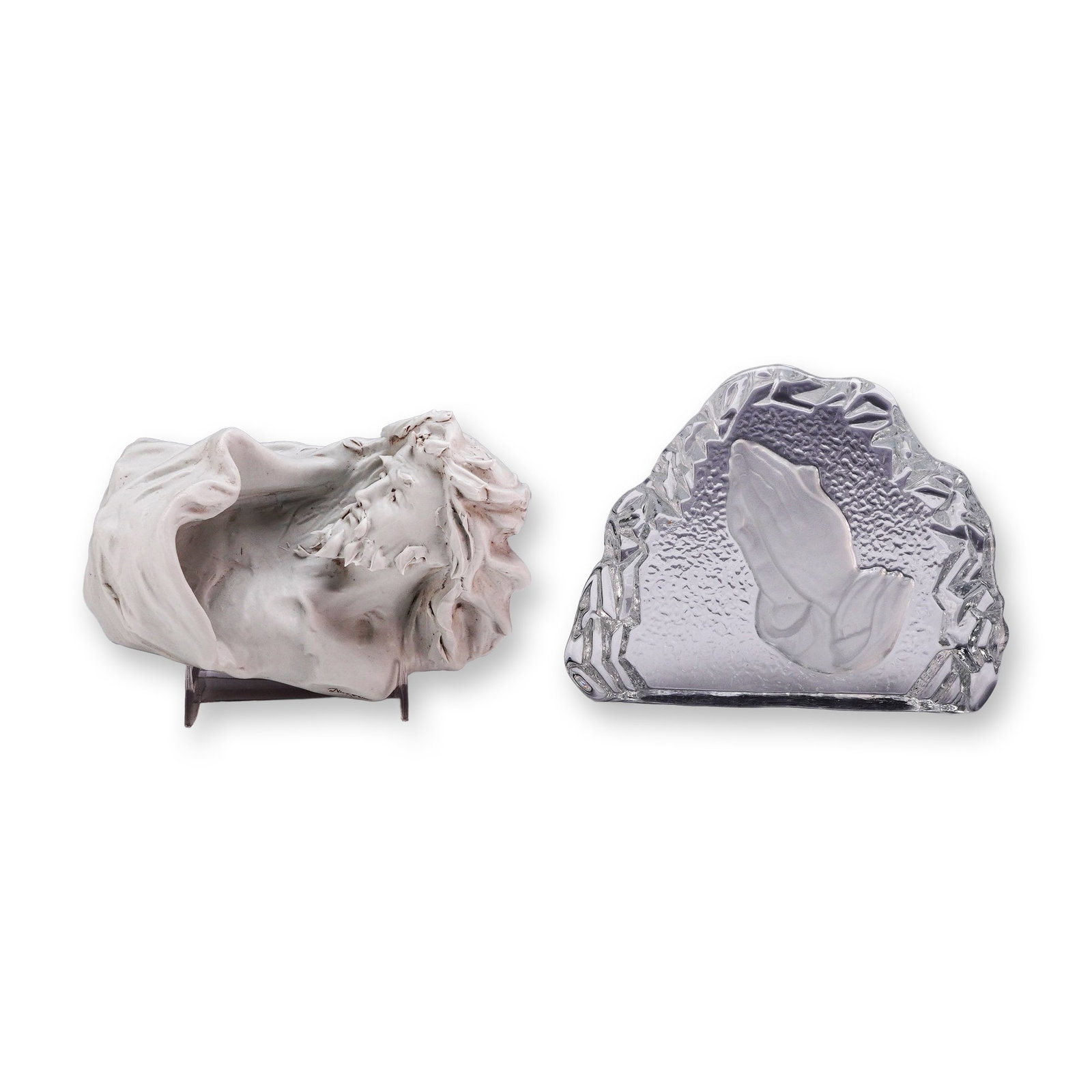 2pc Religious Figures, Nico Venzo Ceramic Figurine and Prayer Hands Glass Plaque: This lot features two religious-themed decorative pieces consisting of a signed ceramic bust and a molded glass relief plaque. The first is a matte white bisque porcelain bust depicting Jesus Christ w
