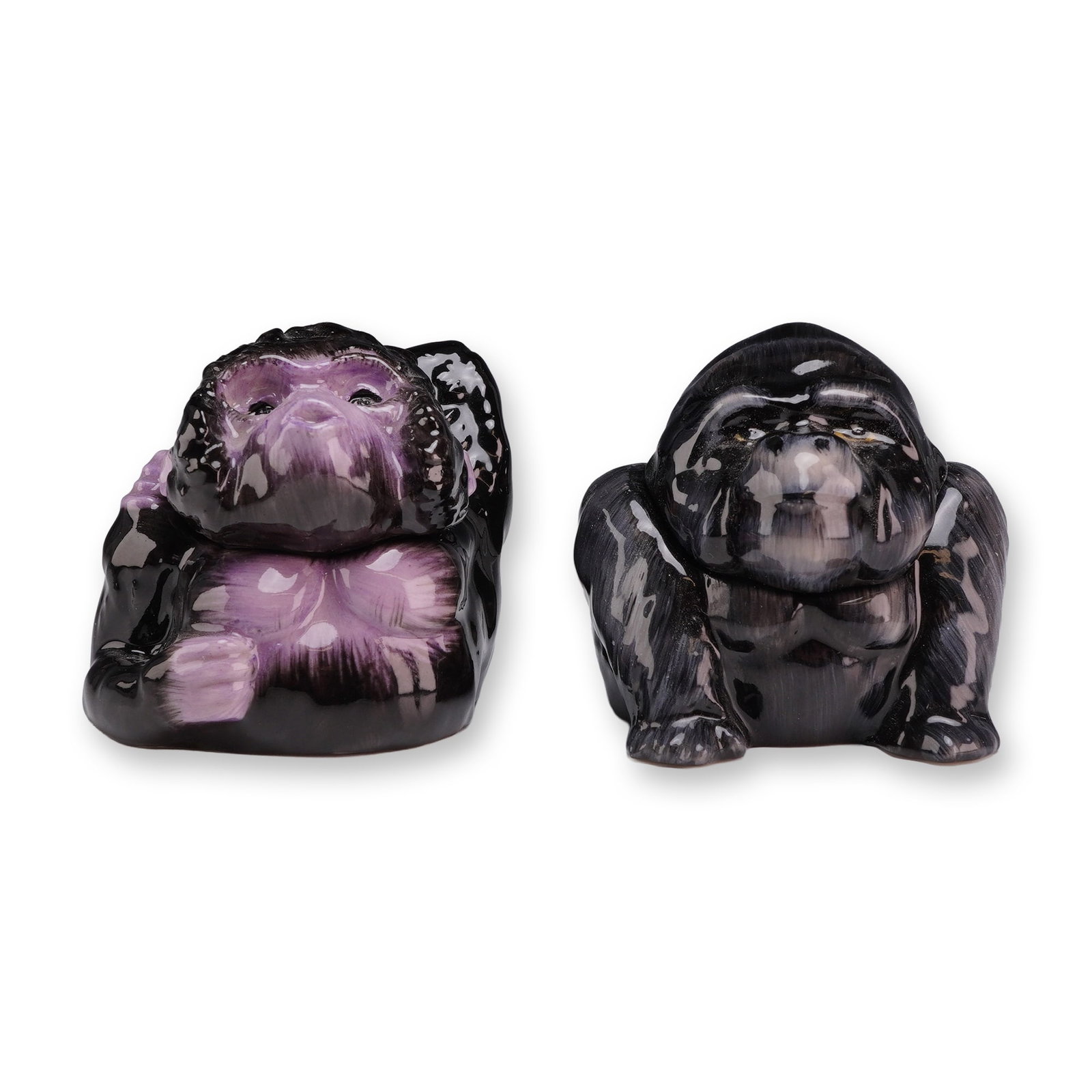 A Pair of Kevin Francis Face Pots, Clyde Prototype and Congo Gorillas: This pair of glazed ceramic lidded jars, known as Face Pots, was produced by Kevin Francis in England. Each piece consists of a pot base and a lid that forms the upper portion of the gorilla head. The