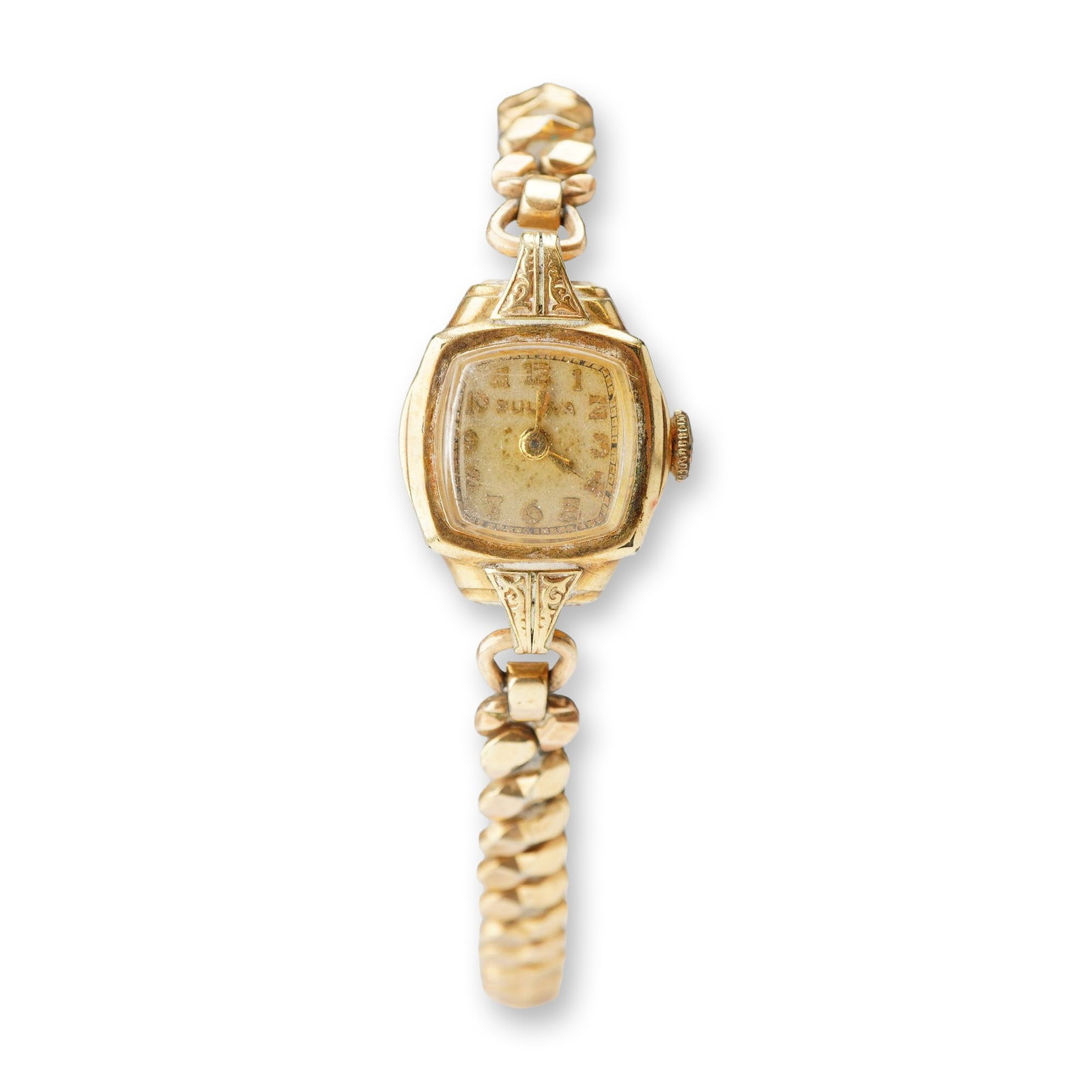 Bulova Vintage 10K Gold Filled Ladies Cocktail Watch: Bulova vintage ladies mechanical cocktail watch in a 10K gold-filled case. The tonneau-shaped case features ornate decorative engraved lugs and a champagne dial with gold-tone Arabic numeral hour mark