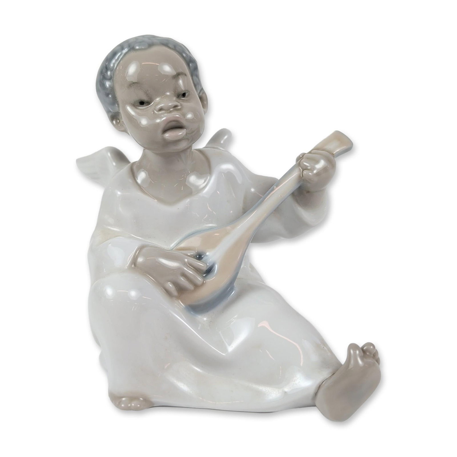 Lladro Spanish Porcelain Black Angel with Mandolin: Lladro glossy glazed porcelain figurine of a seated black-winged angel playing a mandolin, model 4537. The angel wears a white robe with grey accents on the hair, wings, and instrument. It comes with 