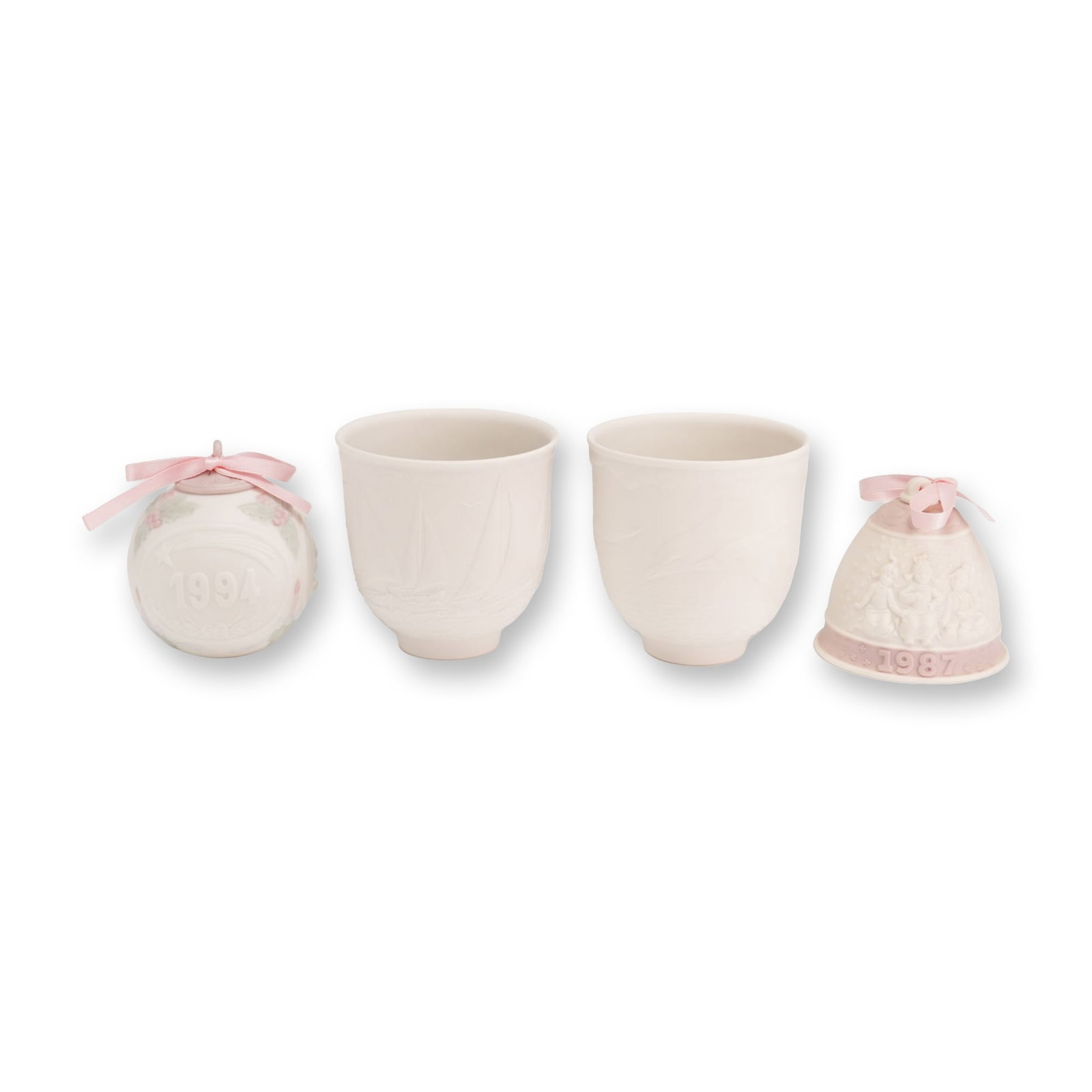 4pc Lladro Porcelain Ornaments and Collectors Society Candle Holders: This lot features a collection of four matte white porcelain pieces by Lladro, manufactured in Spain. The grouping consists of commemorative holiday items and exclusive releases for the Lladro Collect