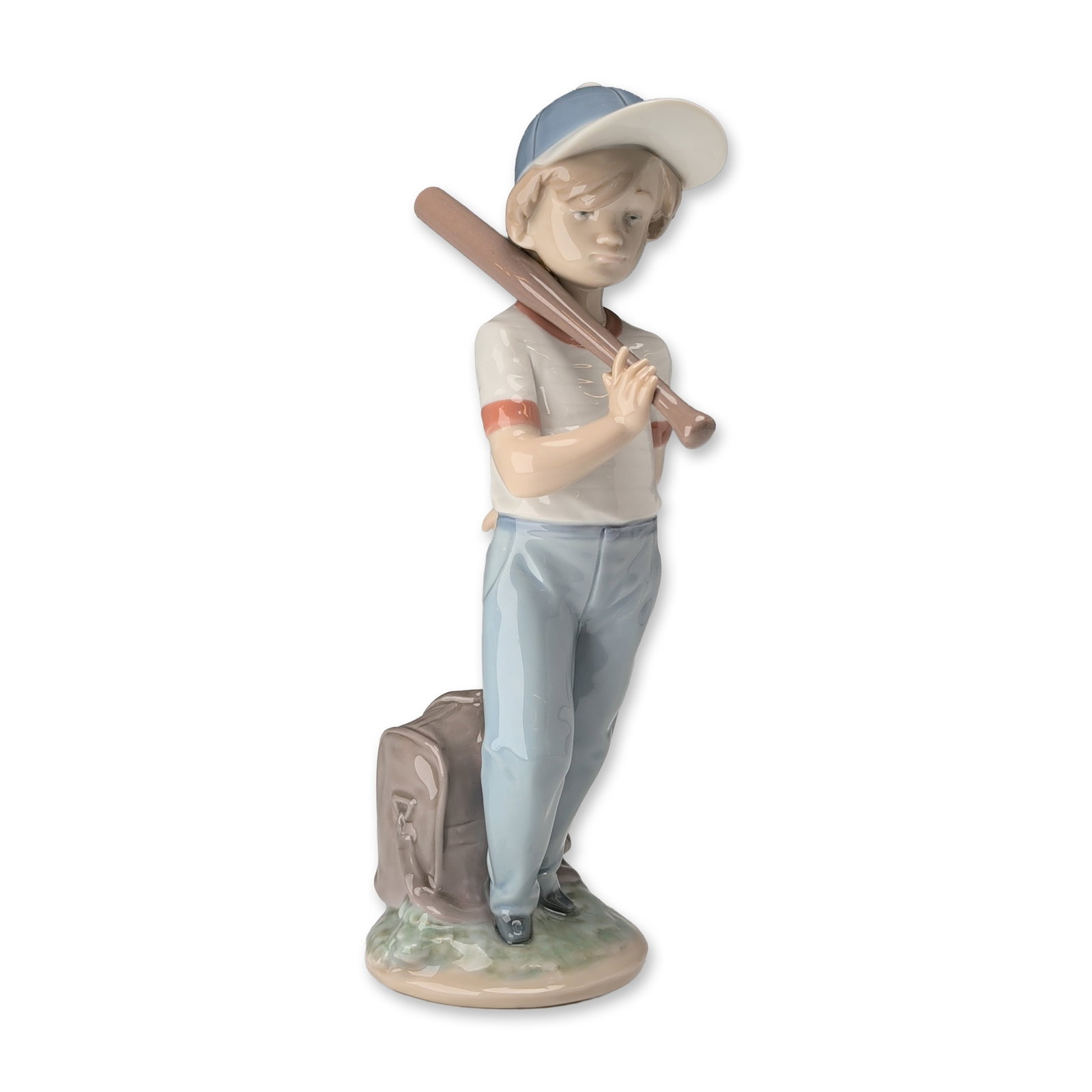 Lladro Spanish Porcelain Can I Play Figurine 7610: Lladro Spanish glazed porcelain figurine titled Can I Play, model number 7610. The piece depicts a young boy holding a bat and ball, with a satchel at his feet. Rendered in a characteristic pastel pal