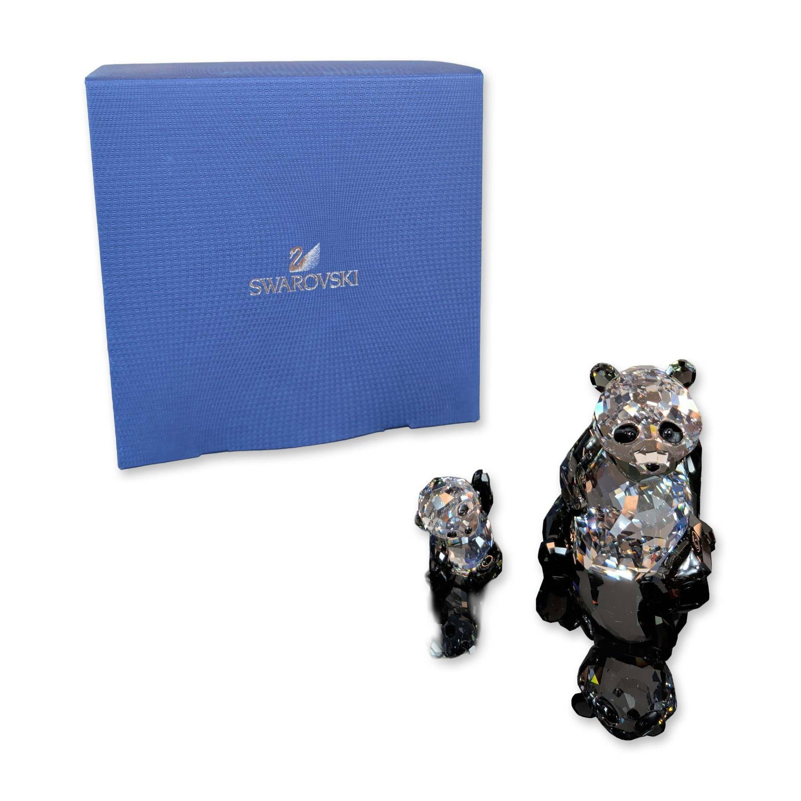 Swarovski Crystal Panda Mother with Baby Figurines: Swarovski. Two-piece set of panda figurines from the Endangered Wildlife series, featuring an adult mother and a smaller cub. Each figure is constructed from faceted lead crystal, with clear crystal b