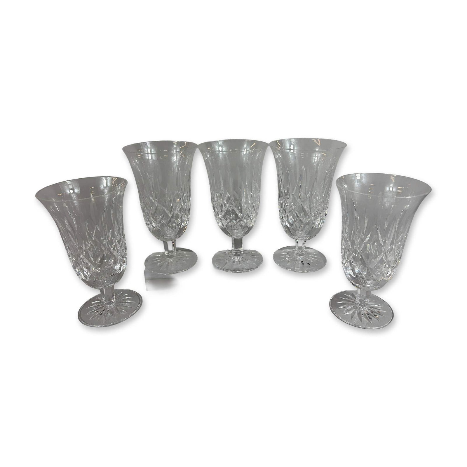 5pc Waterford Lismore Crystal Goblets: Each glass is designed with a bell-shaped bowl decorated with a lower register of criss-cross diamond cuts surmounted by vertical wedge cuts. The pieces include short, faceted stems and circular feet 