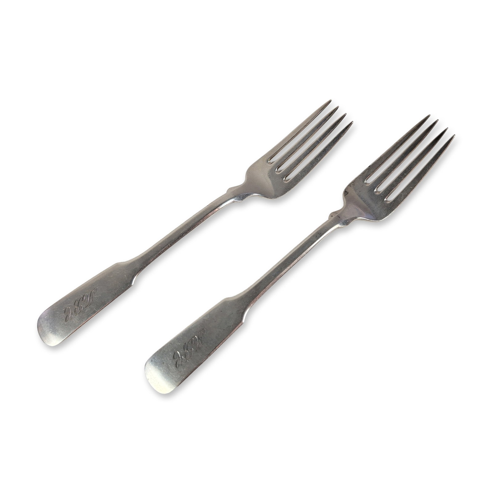 Pair of Watson Company Sterling Silver Forks: Watson Company (Attleboro, Massachusetts). Pair of forks in sterling silver, featuring an elongated fiddle-style pattern with flared spatulate terminals. Each handle is engraved with a script