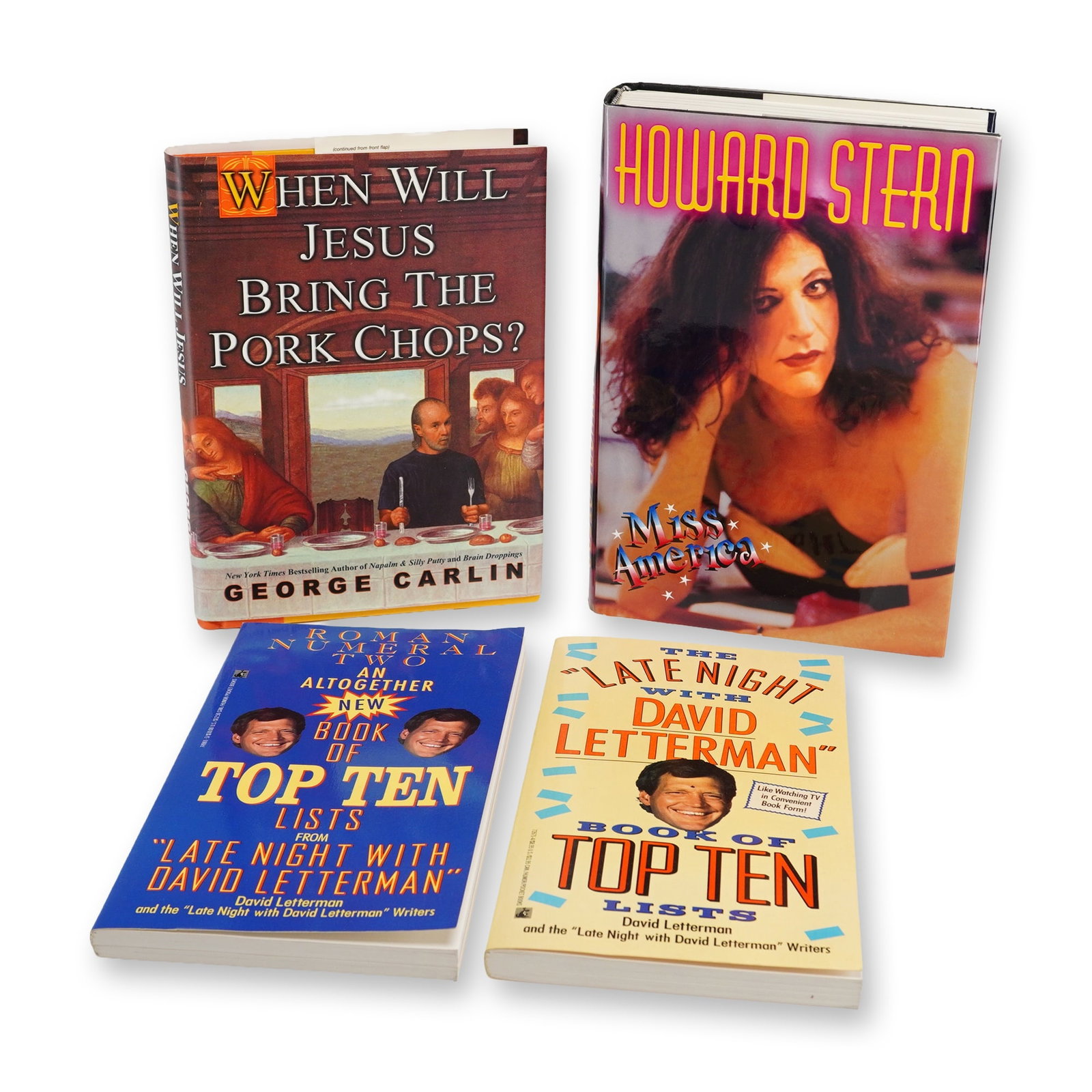 4pc Collection of Hardcover and Softcover Comedy Theme Books including Carlin and Stern.: Four-piece collection of hardcover and softcover comedy theme books featuring works by prominent American comedians. The collection includes two hardcover volumes in dust jackets and multiple softcove