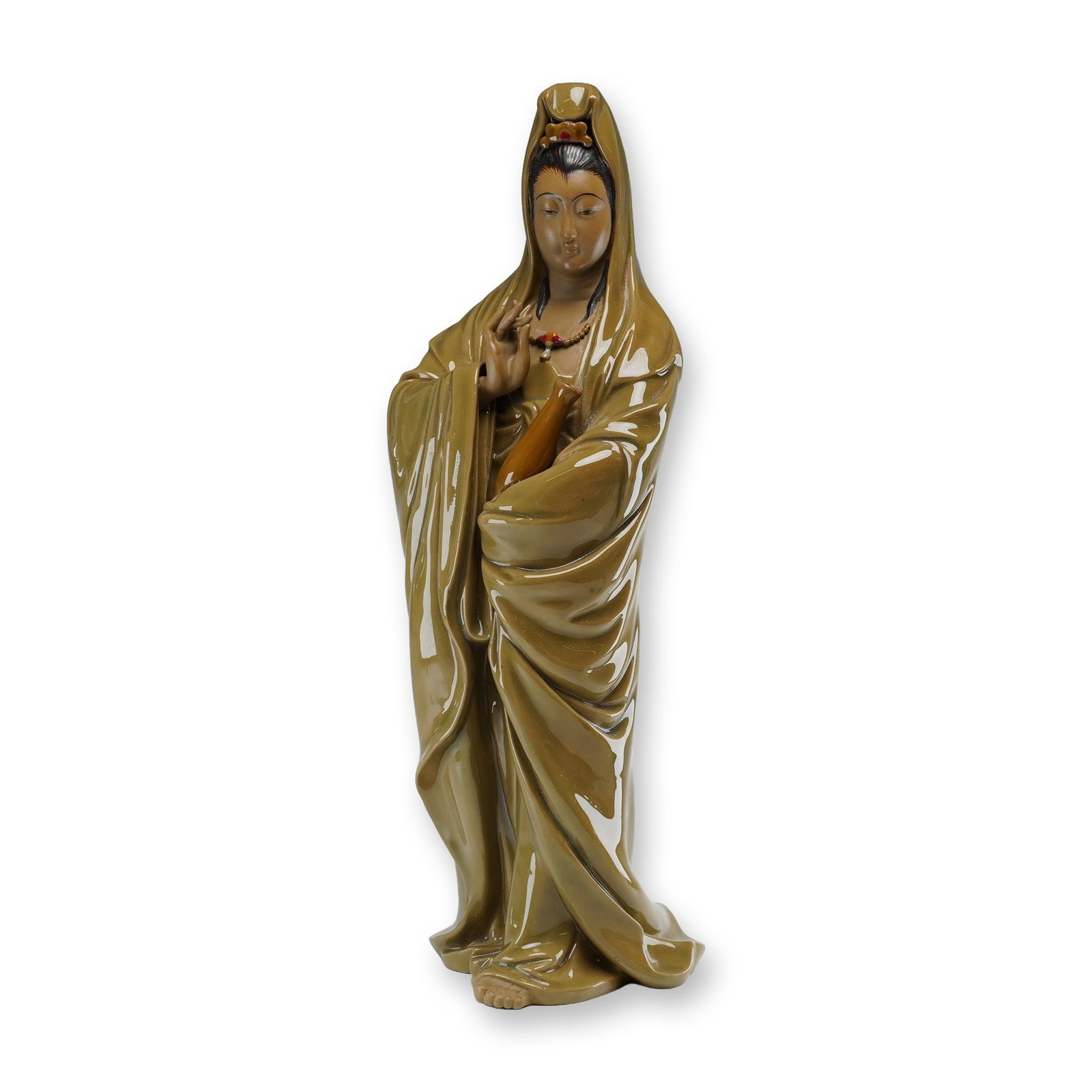 Chinese Shiwan Glazed Porcelain Figure of Guanyin: A Shiwan porcelain statue of the Chinese goddess of Mercy, Guanyin, depicted as a standing female figure. The piece is finished in a high-gloss, monochrome ochre or mustard-yellow glaze with finely de