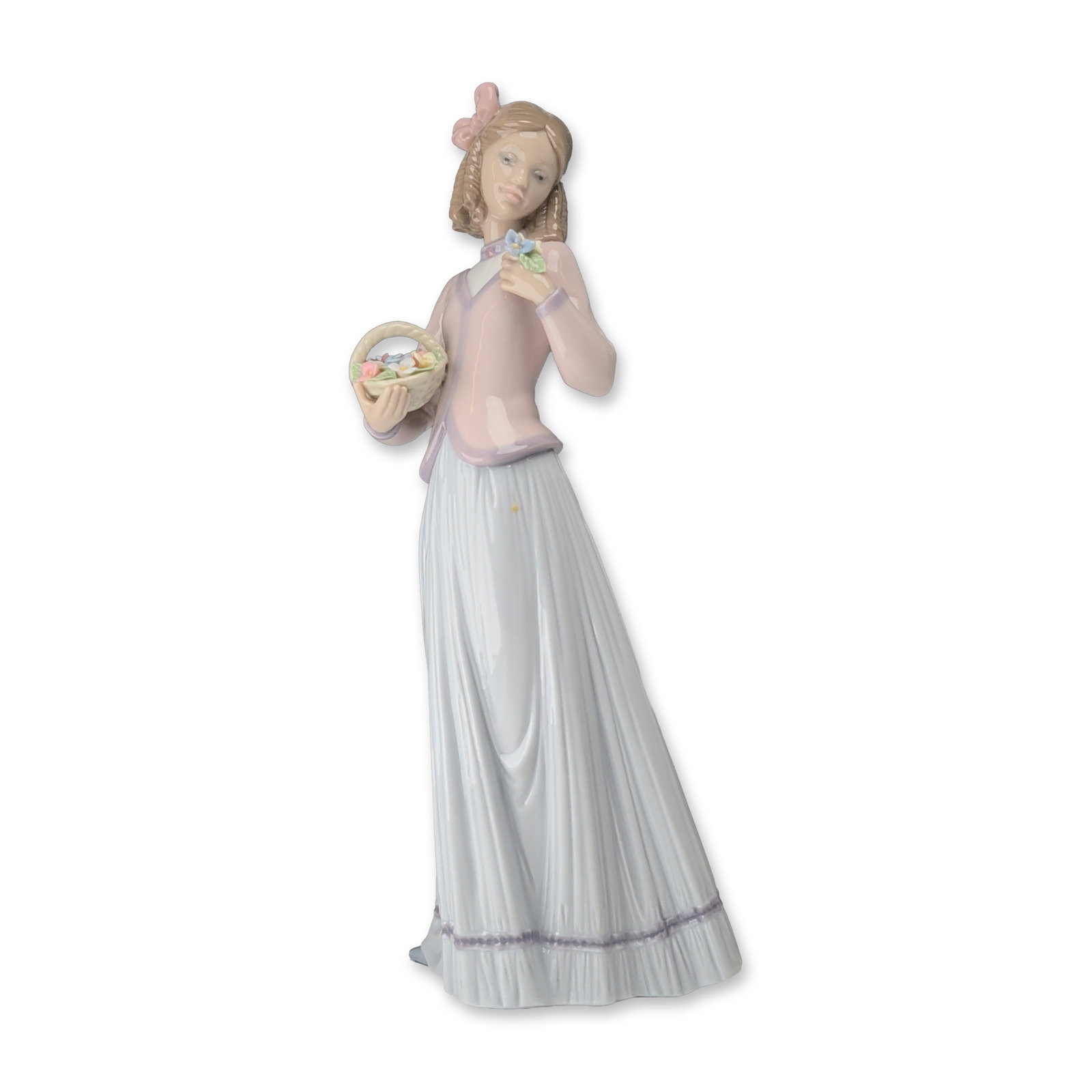 Lladro Innocence in Bloom Porcelain Figurine 7644: Lladro 1996 Collectors Society annual porcelain figurine titled Innocence in Bloom, model number 7644. Hand-painted glazed finish featuring a young girl with a pink hair bow, wearing a light pink jack