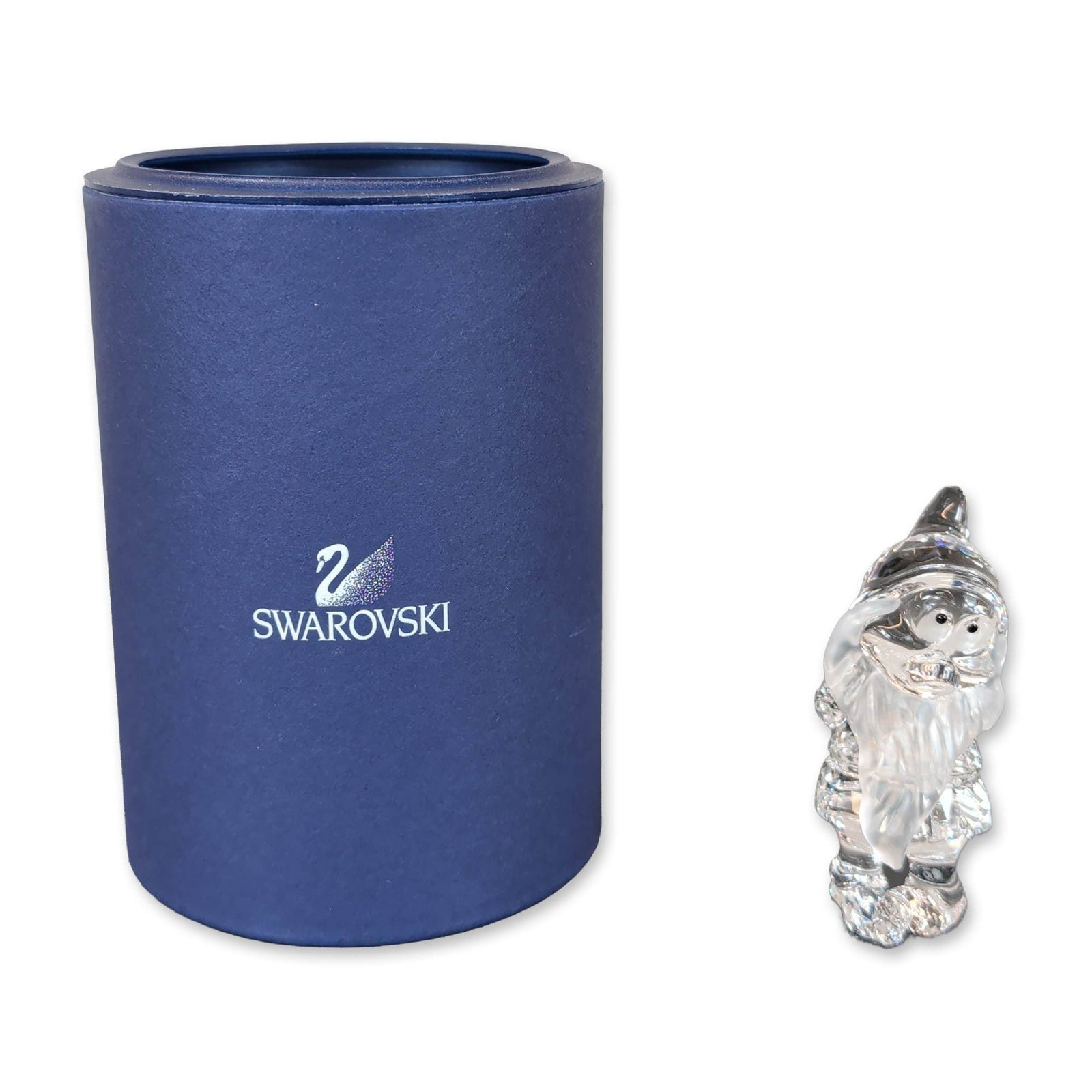 Swarovski Crystal Disney Snow White Bashful Figurine: Swarovski crystal Bashful figurine, featuring a faceted clear crystal body and pointed hat with a long frosted crystal beard. The figure includes two small black-toned crystal eyes. Etched Swarovski s