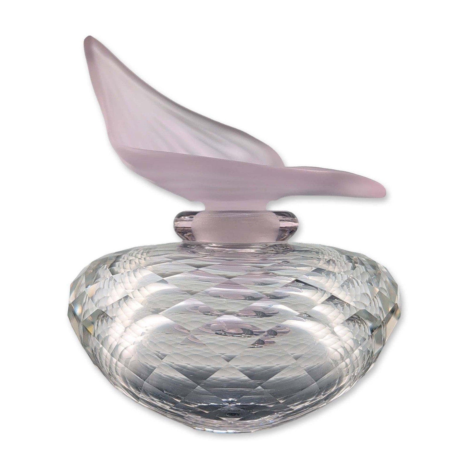 Swarovski Rose Flacon Crystal Perfume Bottle: Swarovski Silver Crystal miniature perfume bottle featuring a faceted clear crystal discoid body with a diamond-cut pattern. The removable frosted pink glass stopper is fashioned in a stylized leaf fo
