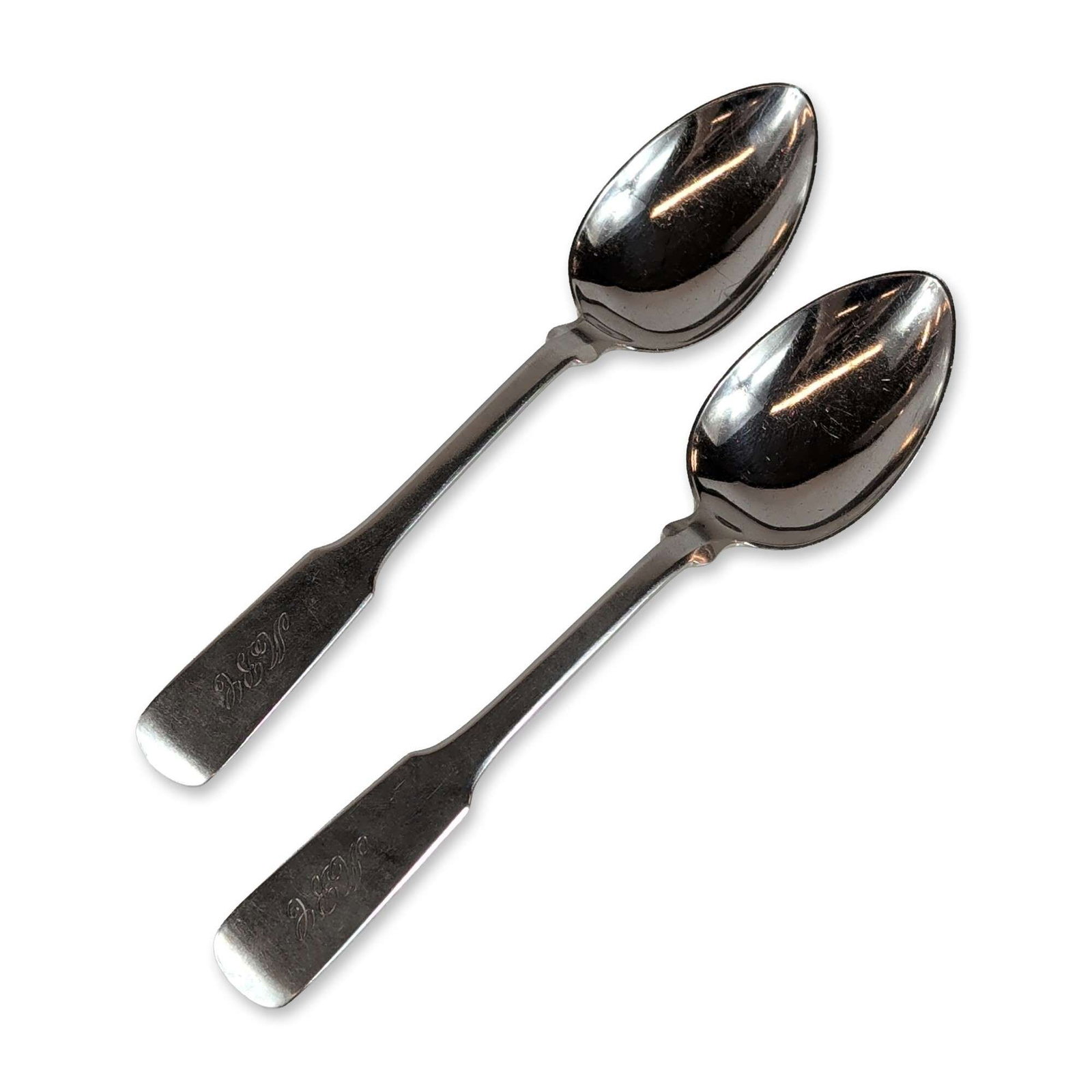 2pc Sterling Silver Soup Spoons: Each piece features a broad handle tapering to a narrow neck and widening toward a rounded terminal. Stamped to the reverse with STERLING and hallmarks. The handles are decorated with a hand-engraved 