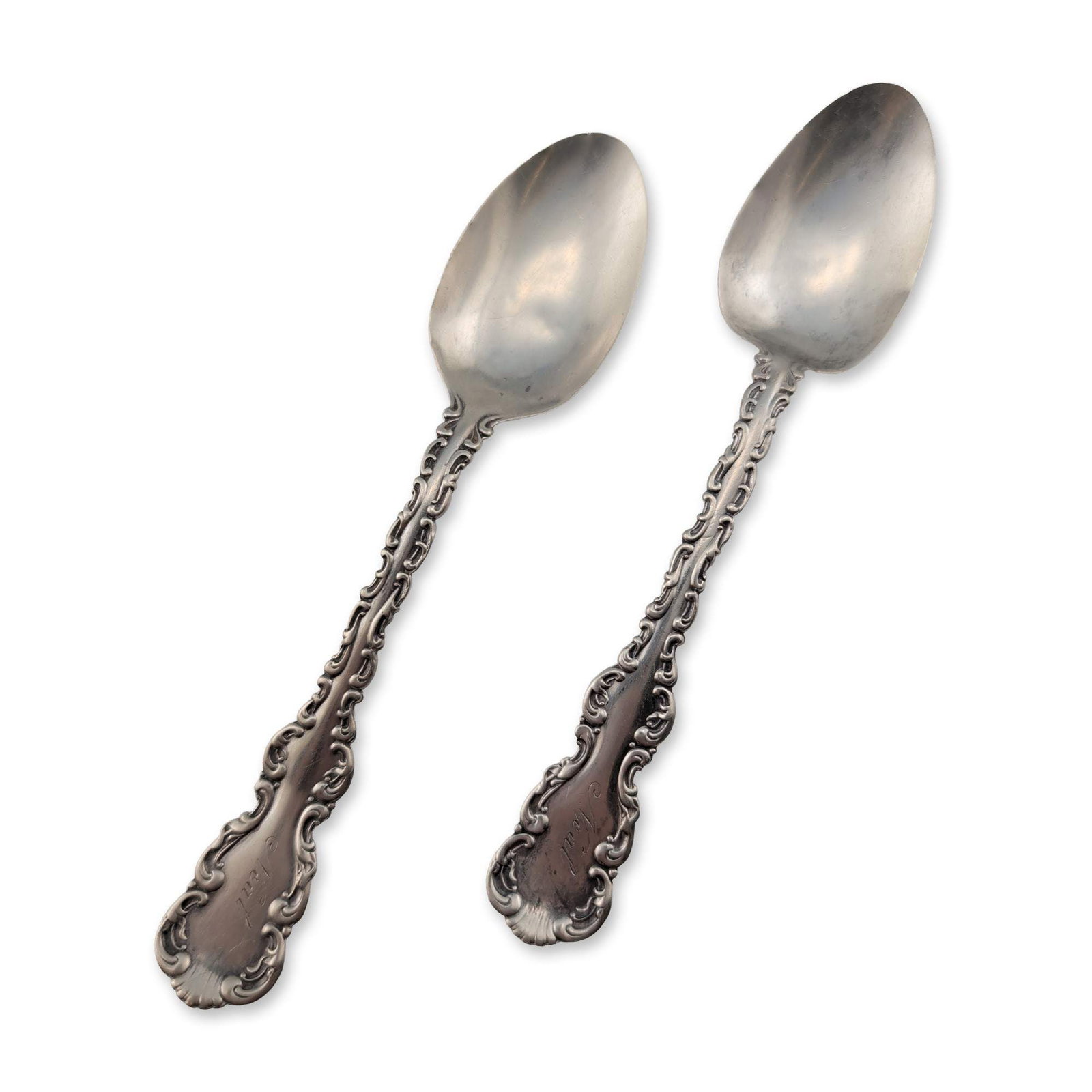 2pc Whiting Louis XV Pattern Sterling Silver Spoons: Pair of sterling silver spoons in the Louis XV pattern, featuring Rococo Revival handles with scrolled edges, acanthus leaf motifs, and shell-form terminals. Front terminals engraved with the name