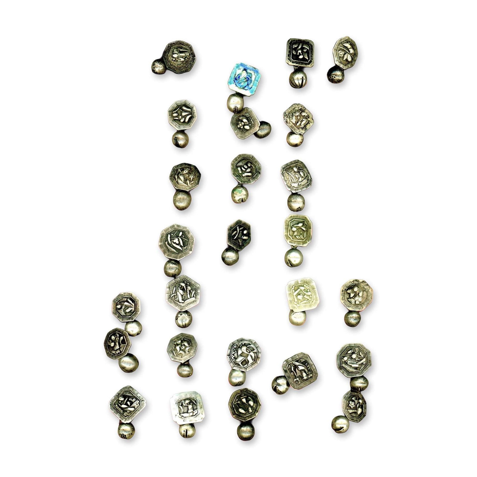 A CARD OF DIVISION ONE CHINESE METAL BUTTONS: 26 Silver Toggle button examples from the 19th century. This is a card of early Chinese silver toggle buttons of two piece construction. Some pictorials and perhaps even an enamel example may be on
