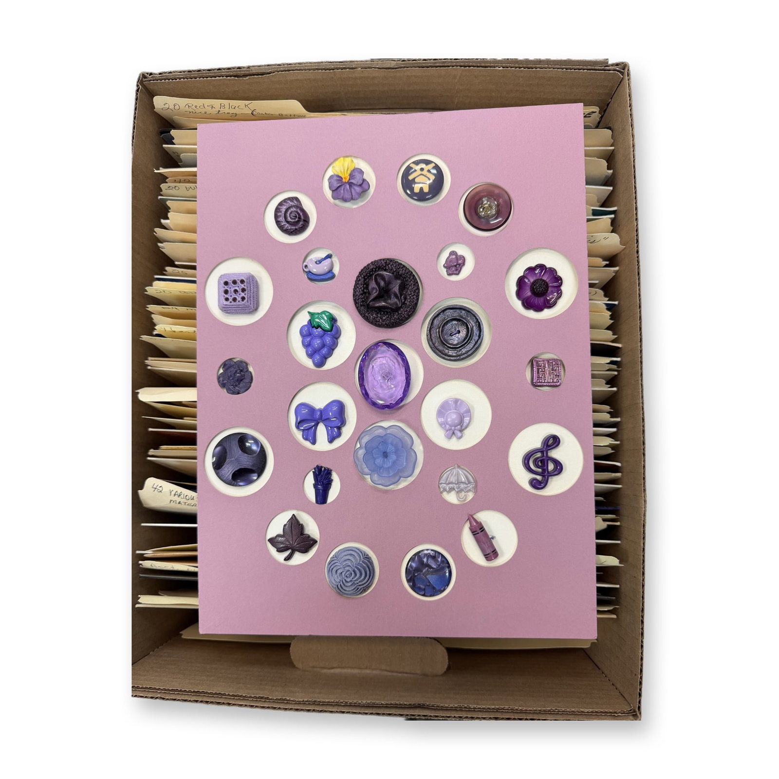 32 CARDS OF ASSORTED PLASTIC BUTTONS: 100'S of assorted colors-shapes, of 20th century plastic examples. These cards include a huge variety and many imitate other materials such as glass and so on. Dimensions: SM=Less than 3/4", Medium=3/
