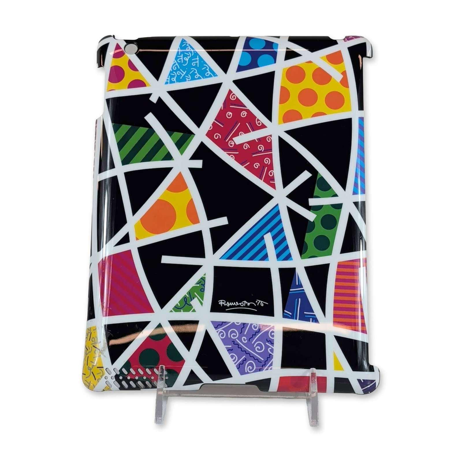 Romero Britto (Brazilian, b. 1963) Midnight Pattern Limited Edition iPad Case Cover: Romero Britto limited edition iPad 2 case cover in the Midnight pattern. Molded case featuring a vibrant pop art geometric design on a black ground with white intersecting lattice. Signed Romero Britt