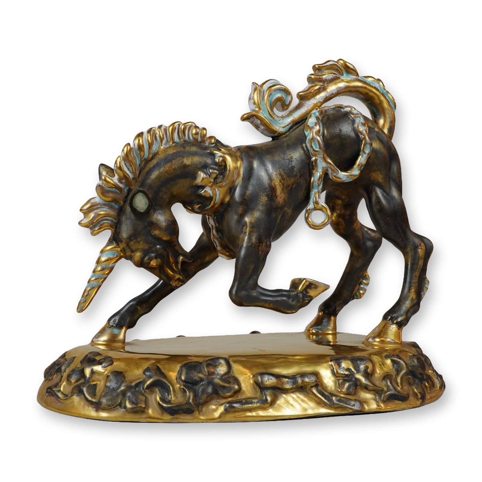 Wedgwood & Co. Ltd. Gilt and Bronz-Colored Porcelain Unicorn Figurine: The figure features a stylized, dynamic form positioned on an oval base decorated with scrolling foliate motifs in relief. The body is finished in a dark brown metallic glaze with a bronzed appearance