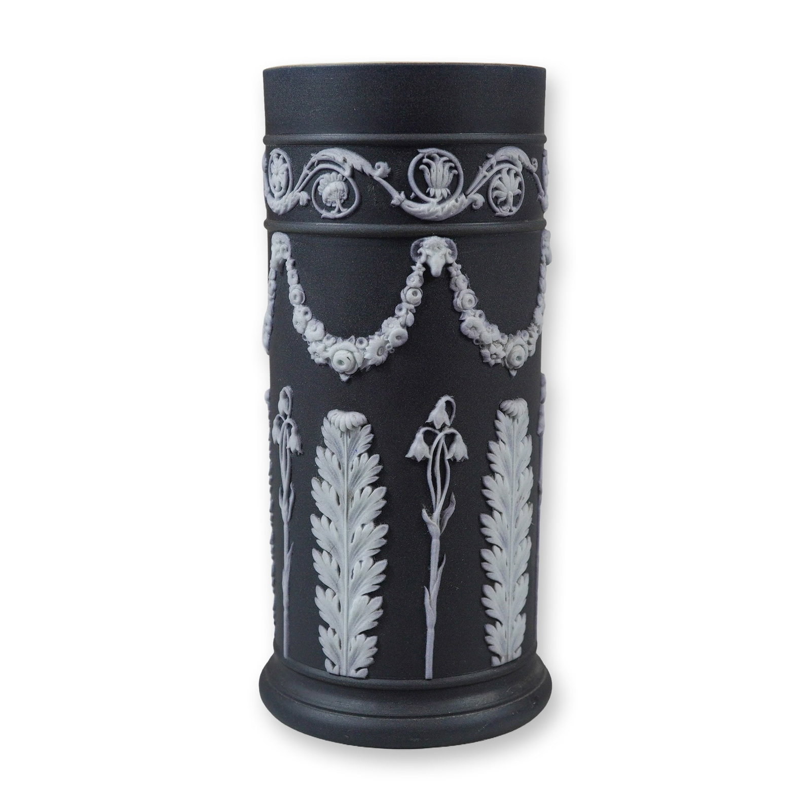 Wedgwood Black Jasperware Dip Neoclassical Spill Vase: This Wedgwood black jasperware dip spill vase is constructed of unglazed black stoneware with applied white bas-relief sprigging. The cylindrical form features a white glazed interior and sits on a