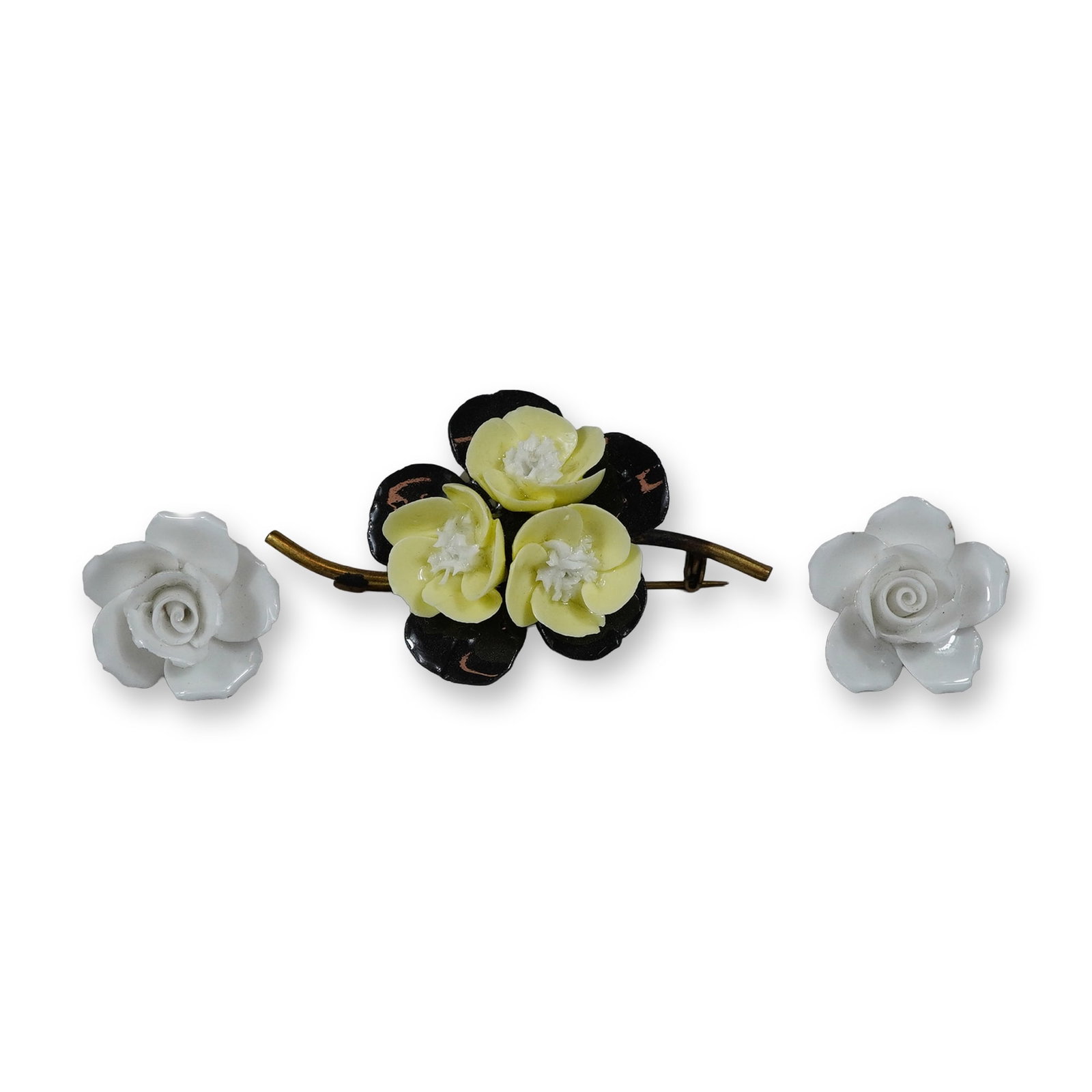3pc Wedgwood Bone China Floral Jewelry Including a Brooch and Pair of Earrings: This group of mid-century costume jewelry is manufactured by Wedgwood and consists of a floral brooch and a pair of screw-back earrings. The brooch is designed with a central cluster of three pale yel