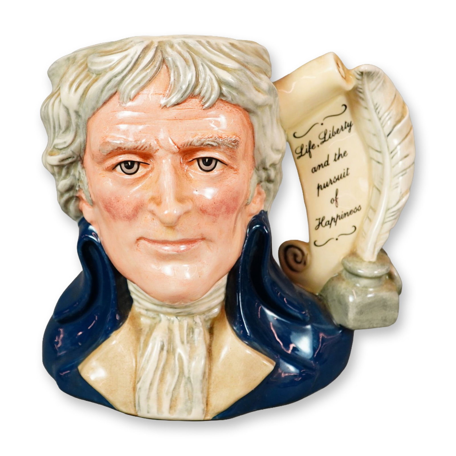 Royal Doulton Large Character Jug, Thomas Jefferson D6943: Royal Doulton hand-painted figural jug depicting Thomas Jefferson, the third President of the United States. Modeled wearing a blue coat and white cravat. The handle is formed as a feather quill, ink 