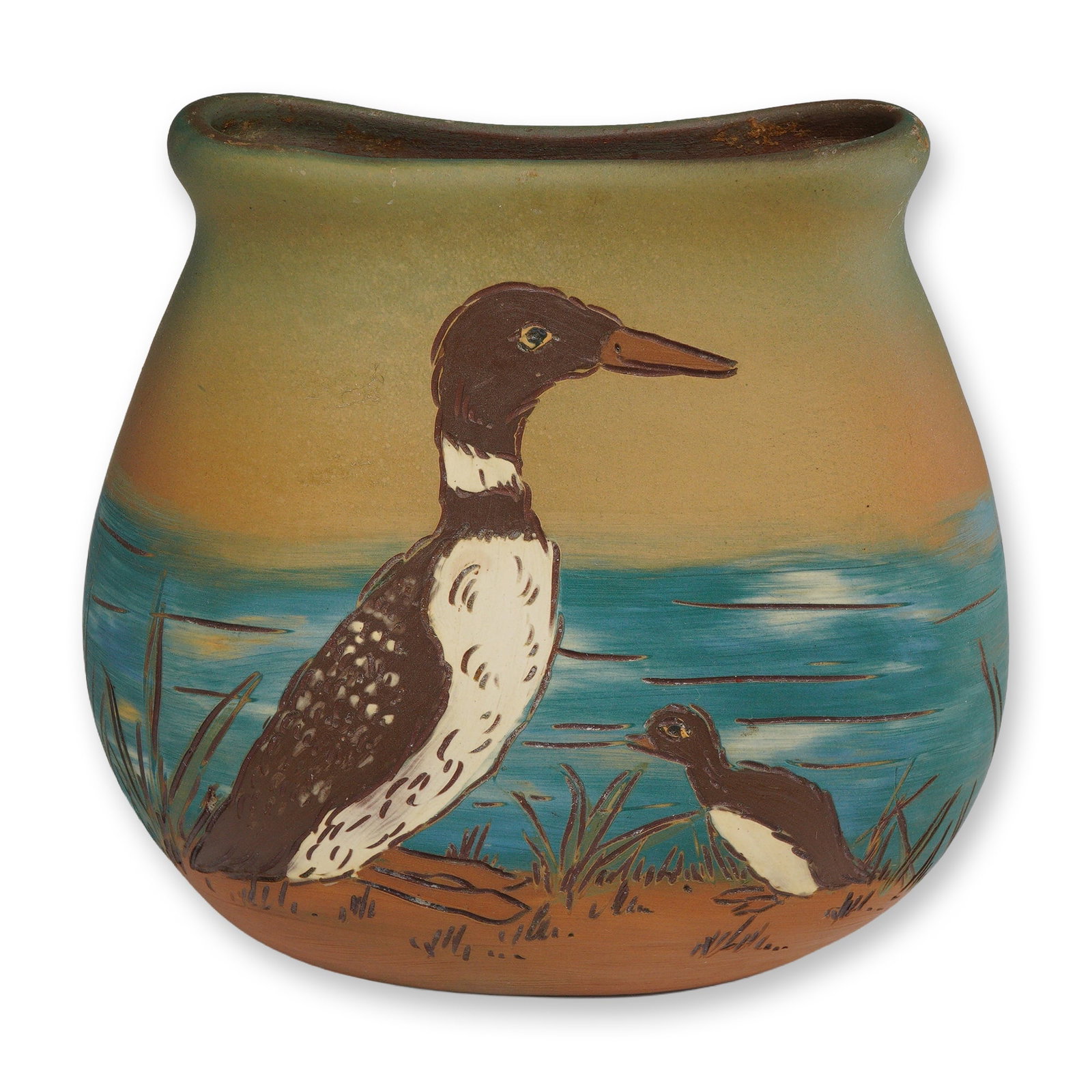 Weller Pottery Sgraffito Pillow Vase, Dickens Ware: A Weller Pottery Dickens Ware ceramic pillow vase featuring a flattened bulbous body and a wide, flared rim. This piece utilizes the sgraffito technique, characterized by incised outlines and hand-pai