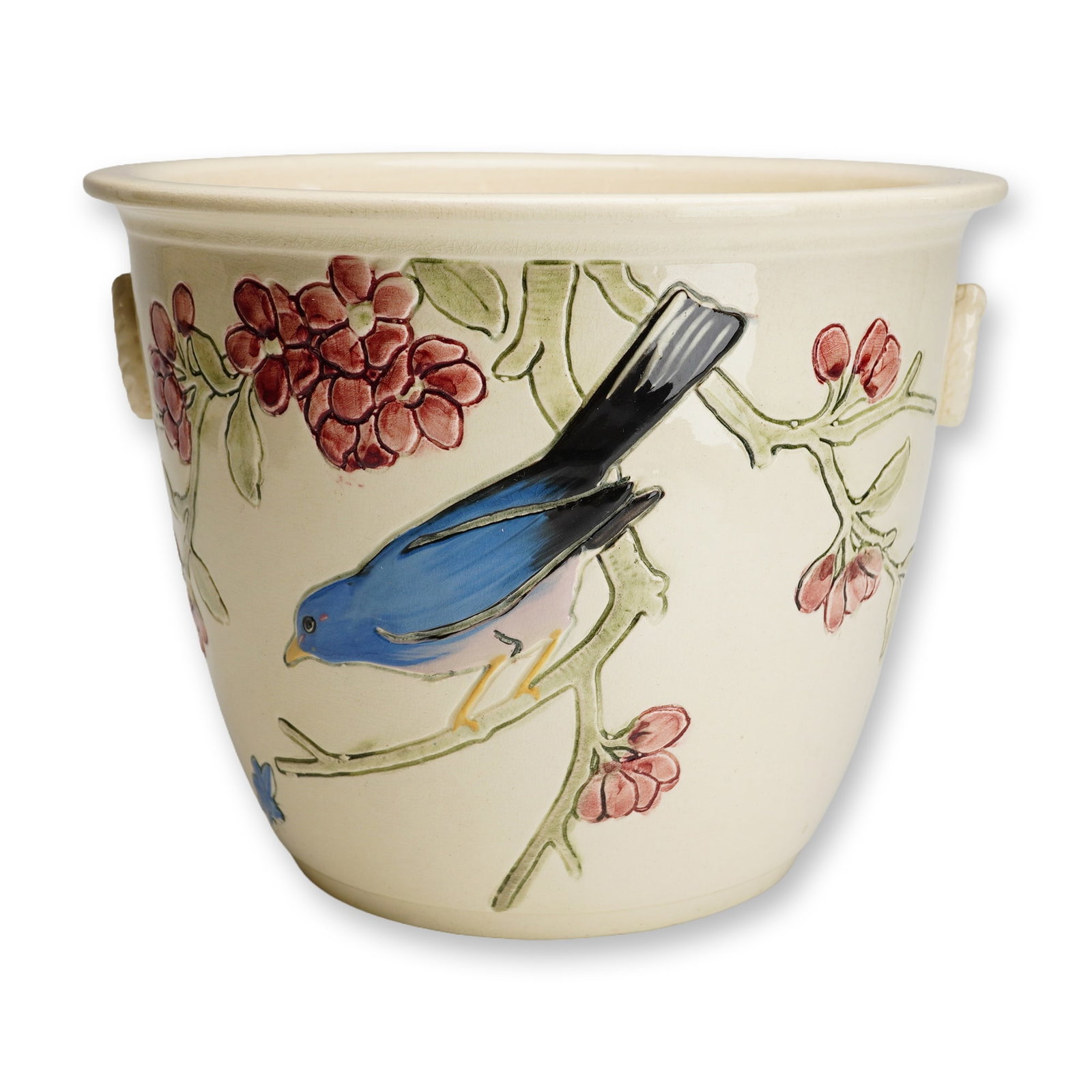 Weller Pottery Blue Bird Jardiniere, Rosemont: This earthenware vessel features a tapered cylindrical form with a flared rim and two small, molded ring handles. The exterior is decorated with a relief-molded and hand-painted scene depicting a vibr