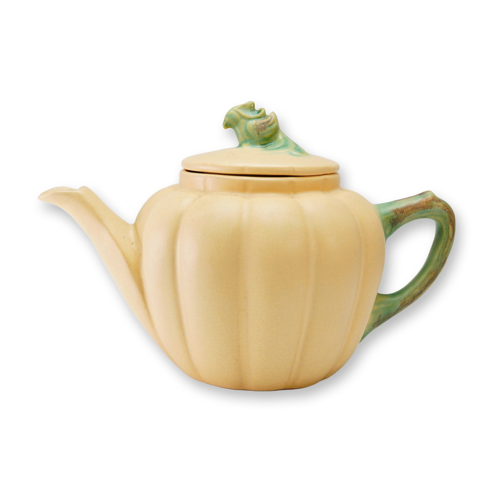 Weller Pottery Utility Ware, Pumpkin Teapot: A Weller Pottery teapot in the Squash or Pumpkin pattern, produced as part of the Utility Ware line circa the 1930s. This ceramic vessel features a lobed, melon-form body finished in a matte, pale