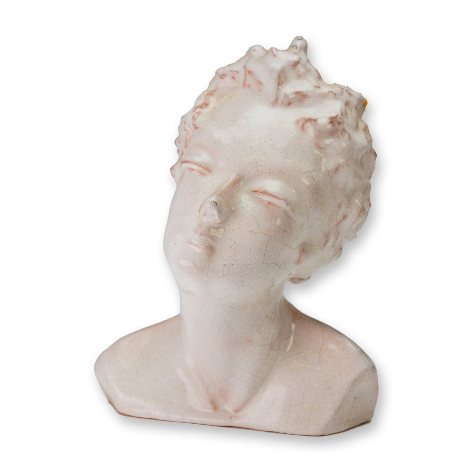 Mountainside Art Pottery Bust: The sculpture is executed in a modernist style featuring a tilted head and contemplative expression. The work is finished with an off-white crackle-glazed slip over a terracotta body, with pinkish und