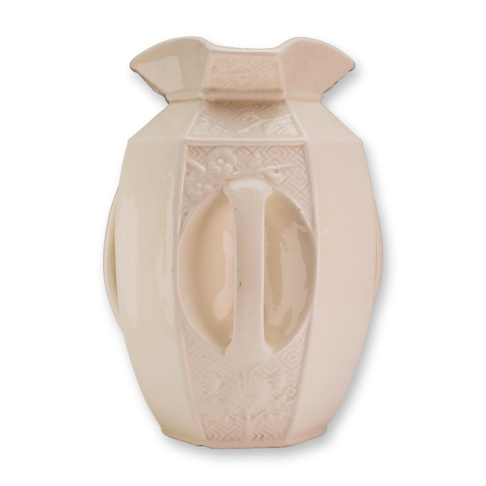 Wedgwood Oetzmann and Co Patent Four Handled Ironstone Vase: This octagonal ironstone vase, manufactured for the retailer Oetzmann and Co., features a faceted, bulbous body with four integrated vertical handles recessed within oval panels. The vessel is finishe