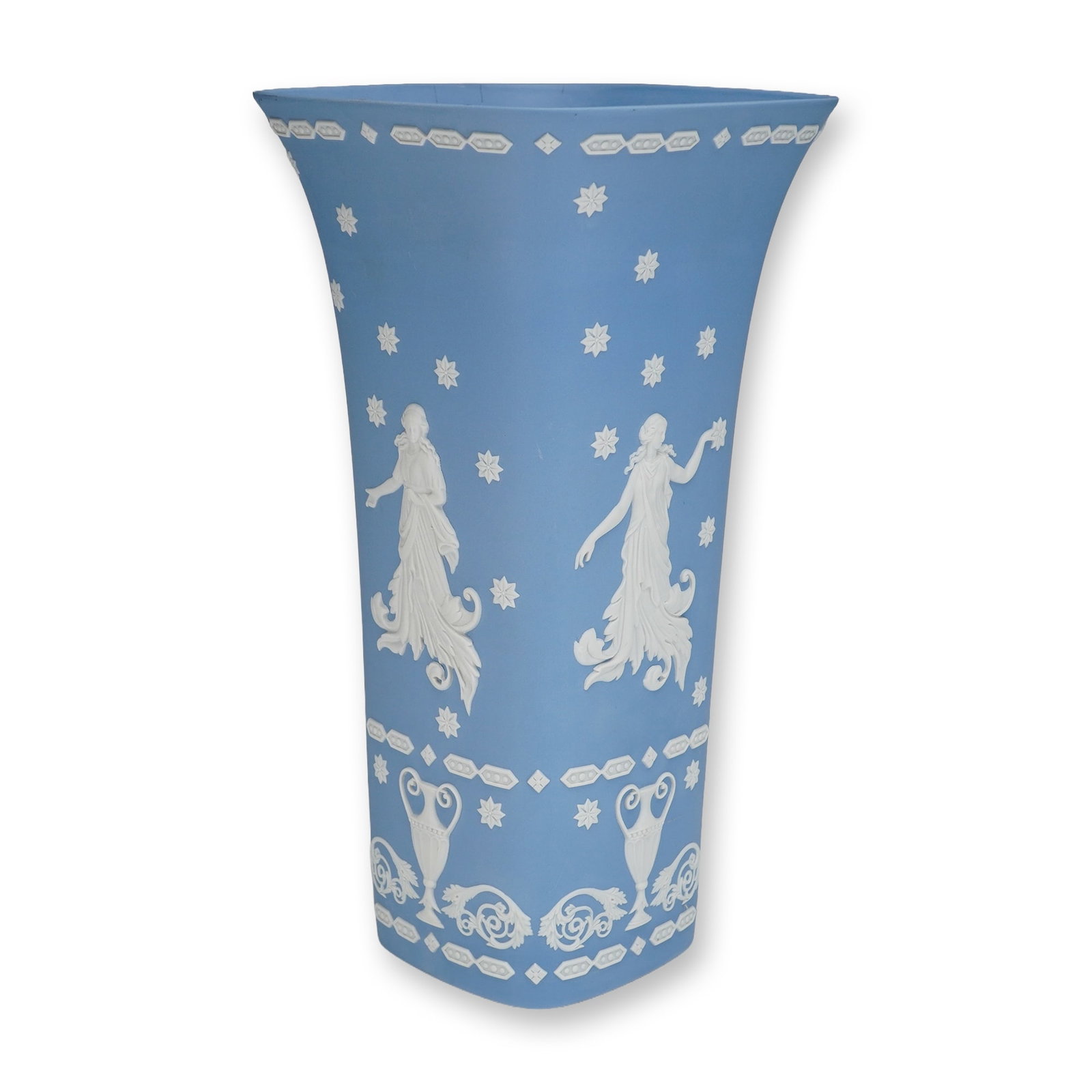 Wedgwood Pale Blue Jasperware Flared Square Vase: This Wedgwood jasperware vase features a flared square, or quadrilateral, form in a classic pale blue color. The body is decorated with white sprigged bas-relief neoclassical figures, depicting dancin