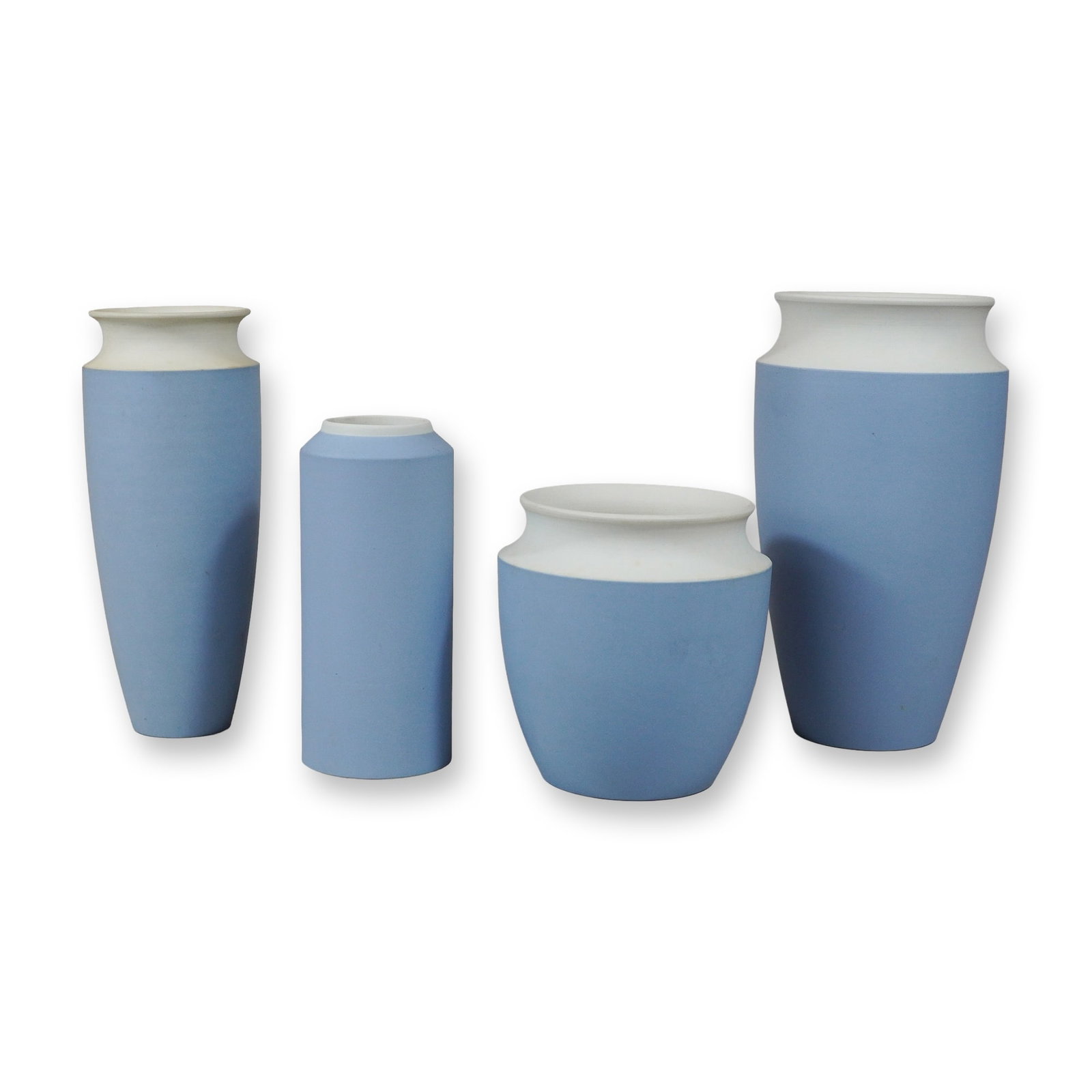 4pc Wedgwood Bicolor Blue and White Jasperware Dip Vases: A set of four Wedgwood Jasperware vases featuring a contemporary two-tone design. This collection is crafted in signature matte unglazed stoneware with a pale blue body and contrasting white upper sec