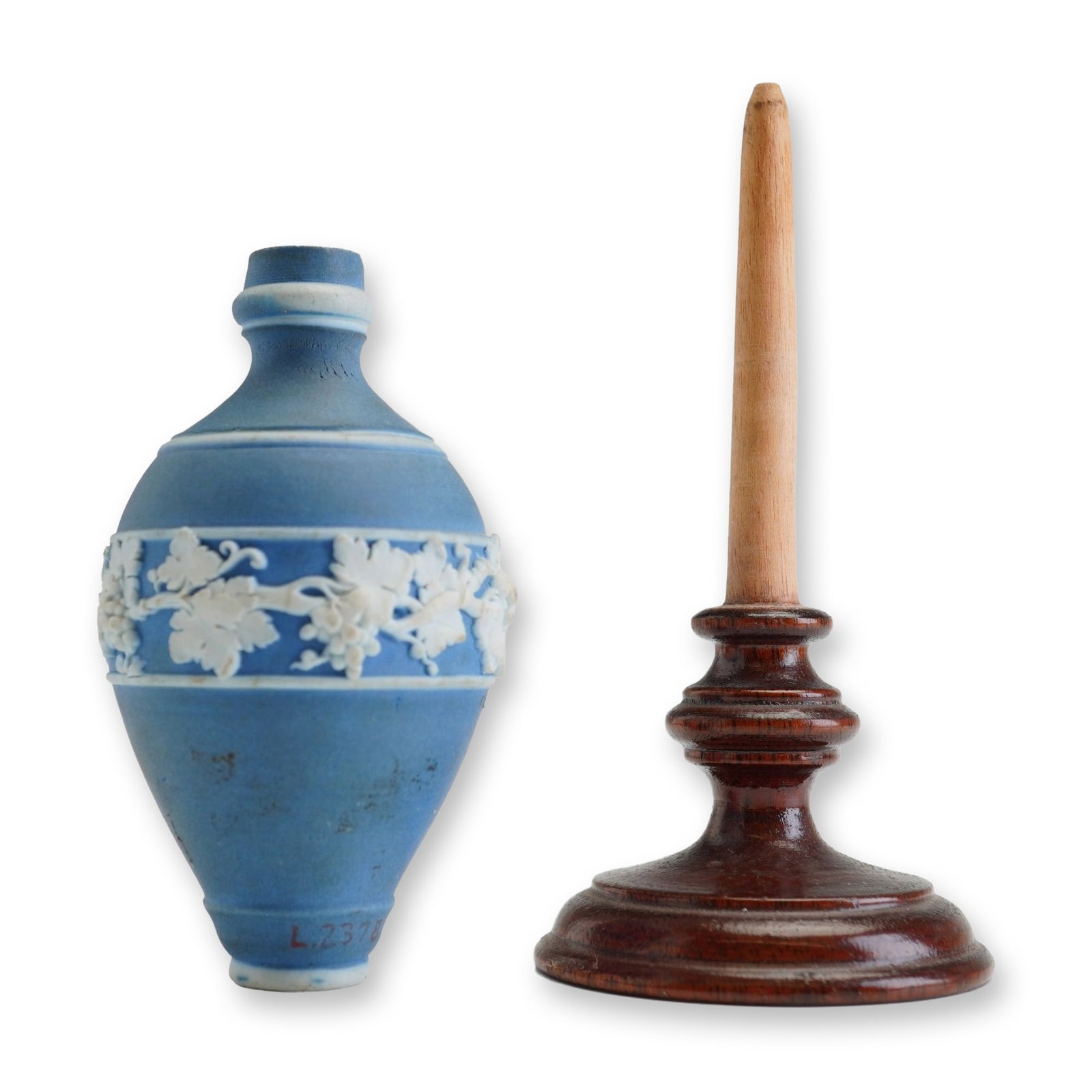 Wedgwood Jasperware Miniature Vase with Stand: This elegant Wedgwood jasperware miniature vase features a classic ovoid ceramic body finished in a light blue jasper dip. Its exterior is beautifully ornamented with an applied white sprigged relief 