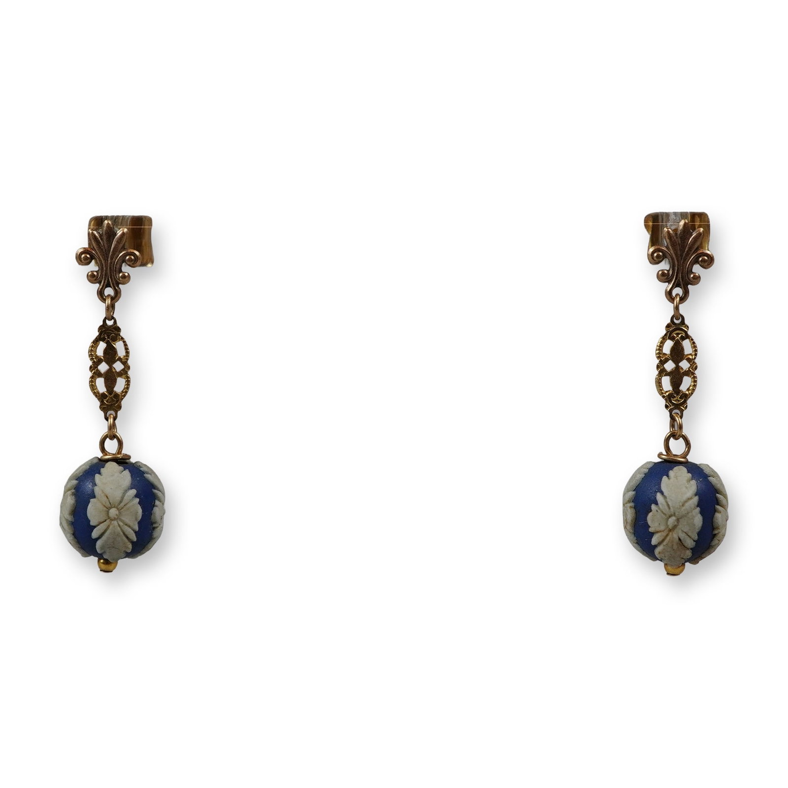 A Pair of 14K Yellow Gold and Wedgwood Jasperware Drop Earrings: A matched pair of vintage drop earrings featuring blue and white Wedgwood jasperware. Each earring is constructed with a 14 karat yellow gold fleur-de-lis post top that suspends an elongated openwork