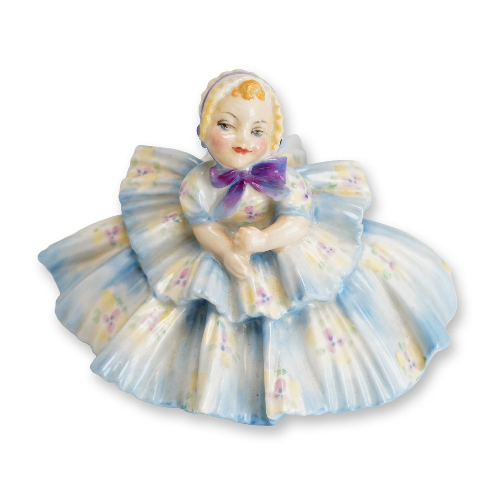 Royal Doulton Porcelain Figurine, Rosebud HN1581: Part of the Harradine - Child Classics collection. Designed by Leslie Harradine. Hand painted depicts a young child in a blue dress with flowers. Royal Doulton backstamp. Artist: Leslie Harradine Dime