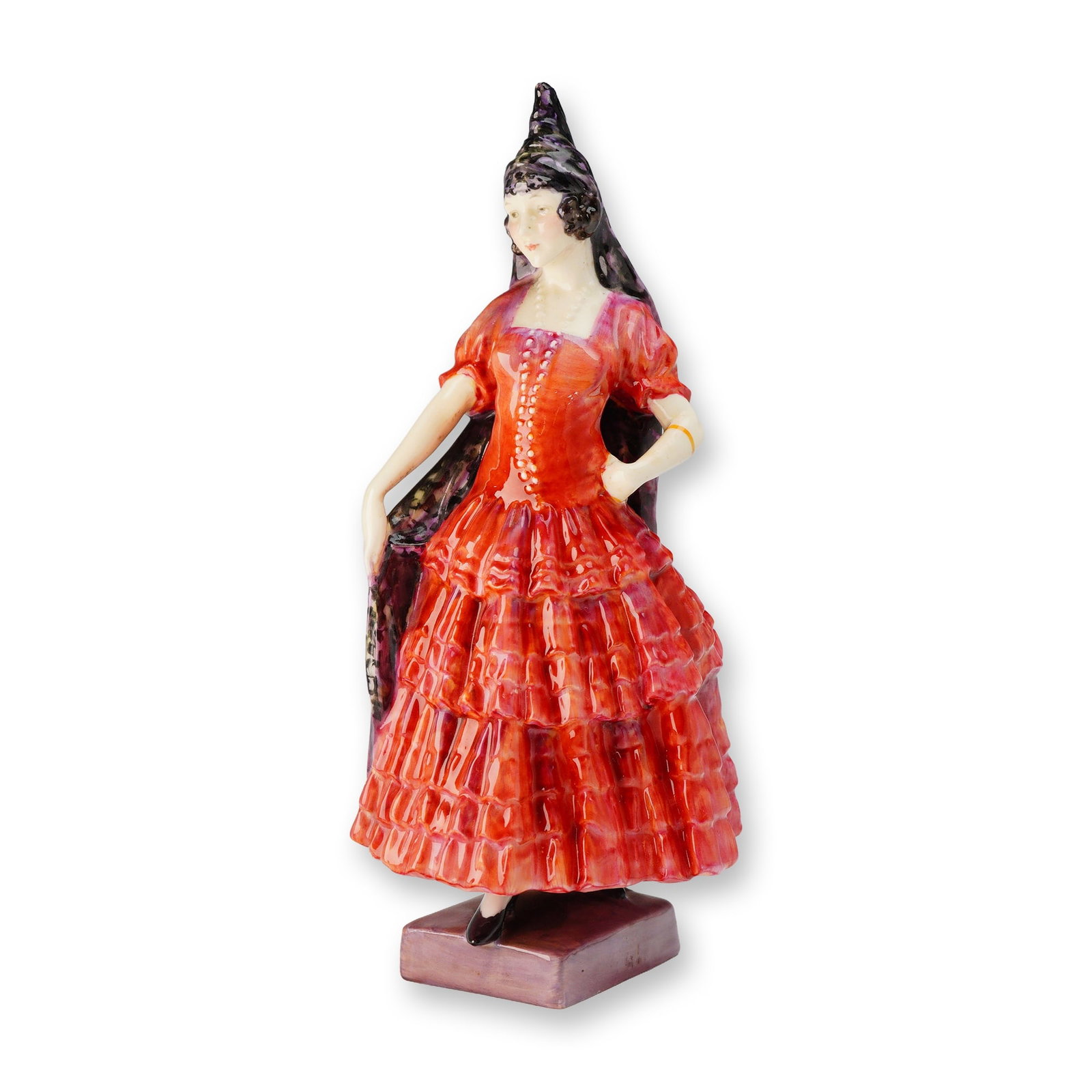 Royal Doulton Spanish Lady HN 1294 Porcelain Figurine: A single glazed porcelain figurine by Royal Doulton, identified as the model "Spanish Lady," HN 1294. The figure depicts a standing female dressed in a high-gloss tiered gown primarily in shades of ve