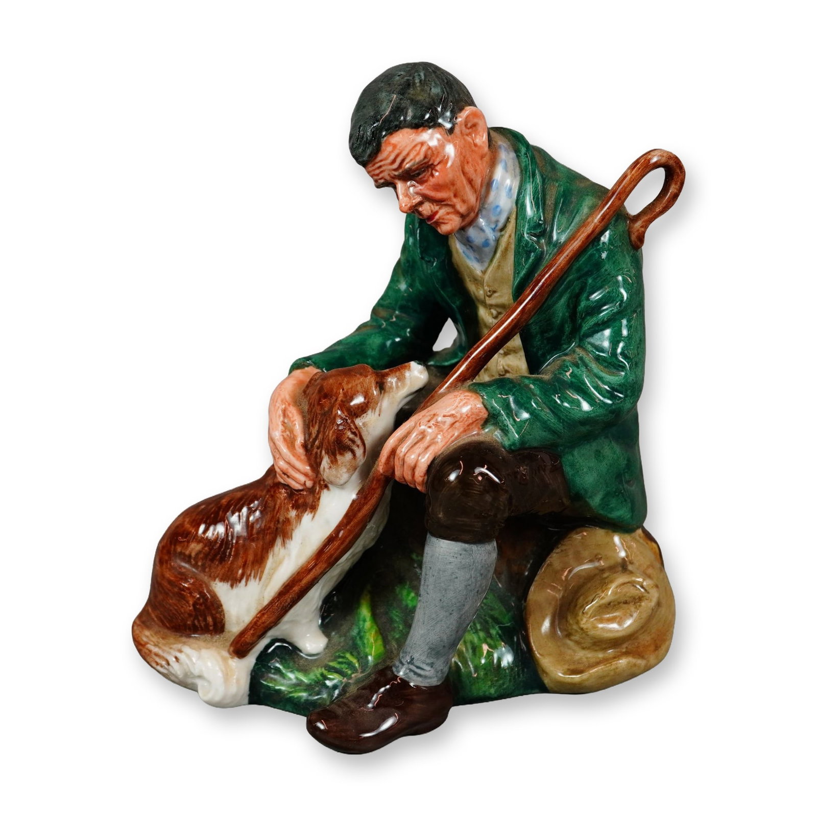 Royal Doulton Porcelain Figurine, Master HN2325: Royal Doulton Farm & Country Series Figurine, designed by Peggy Davies. This hand-painted figure depicts a seated country gentleman accompanied by his faithful dog. Marked on the underside with the Ro