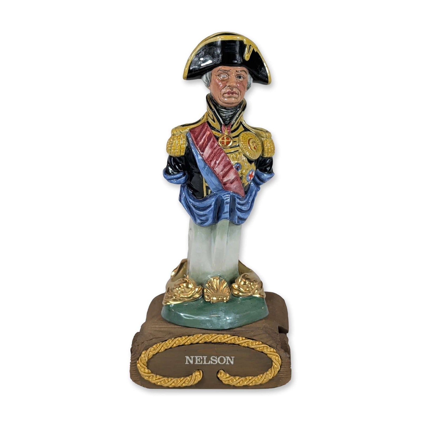 Royal Doulton Ships Figurehead Figurine Nelson with Base HN2928: Royal Doulton (England). Porcelain figurine from the Ships Figureheads series, model HN 2928, titled Nelson. The polychrome glazed ceramic bust depicts the figurehead of H.M.S. Trafalgar, modeled afte