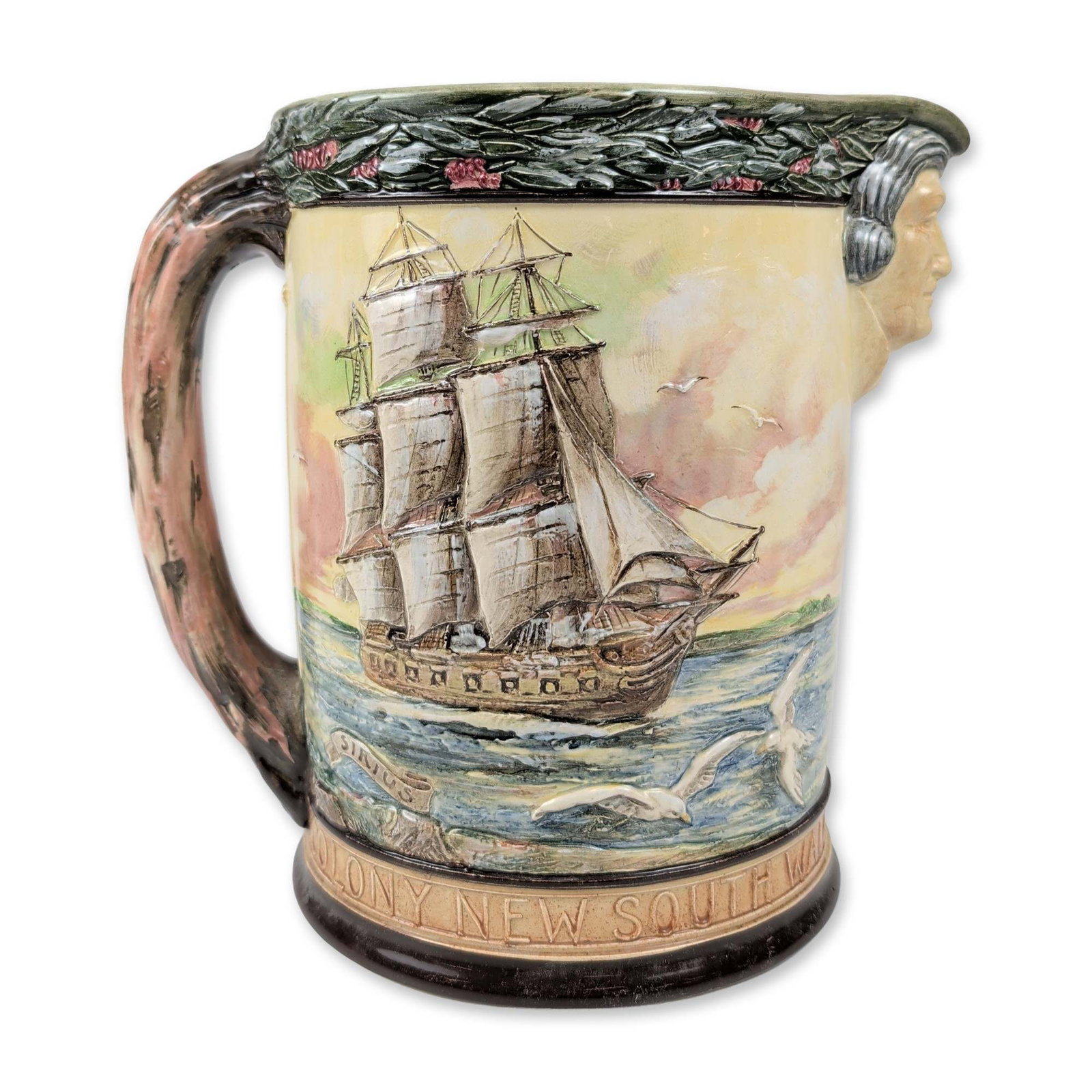Royal Doulton Captain Arthur Phillip Commemorative Jug: Royal Doulton (Burslem, England). Glazed earthenware commemorative jug, circa 1938, produced for the 150th anniversary of the founding of New South Wales and the city of Sydney. The body features mold