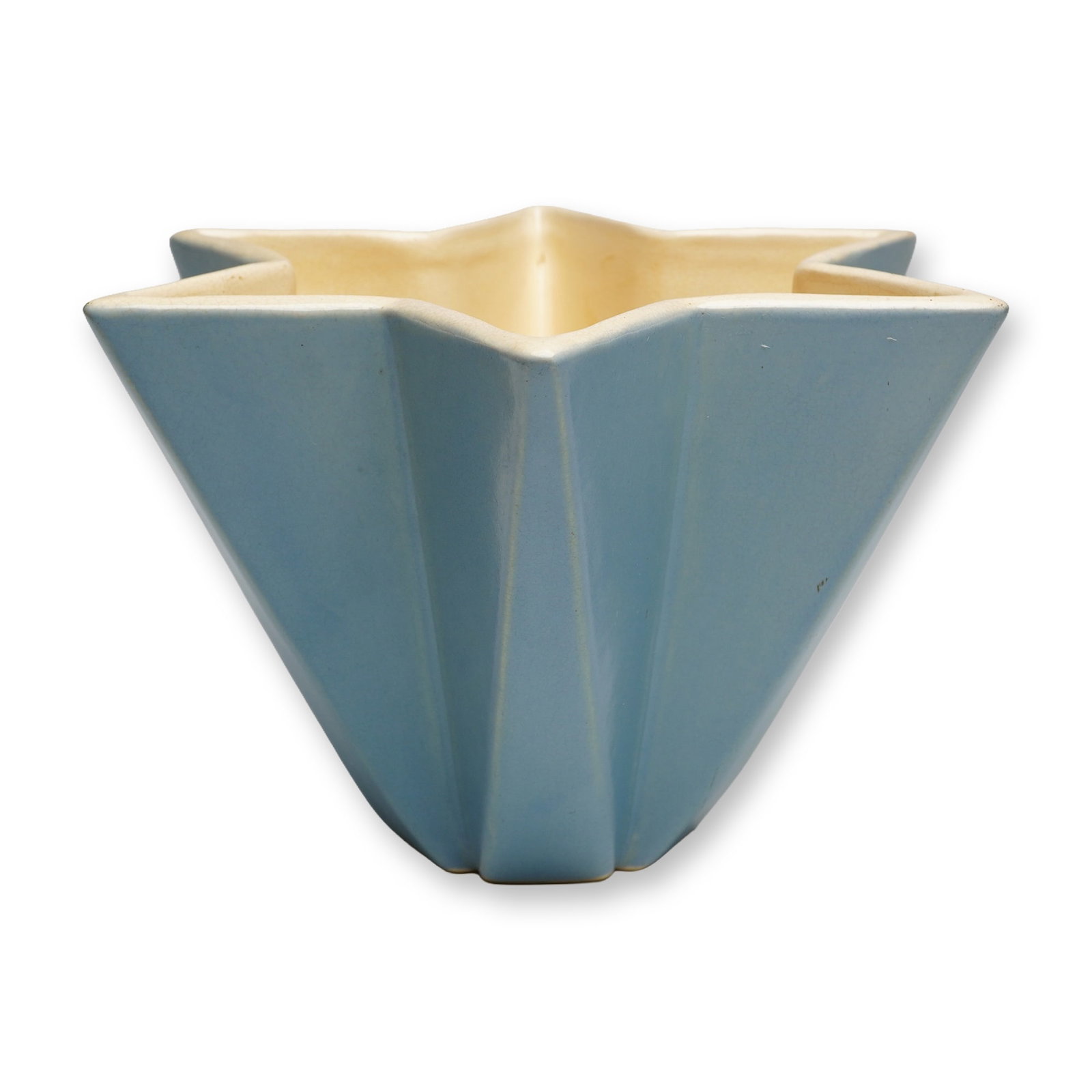Weller Pottery Blue and Cream Vase, Atlas Star: Produced by the Weller Pottery Company of Zanesville, Ohio, this ceramic vase is a notable example from the Atlas line, dating to the Art Deco period circa 1933. The vessel features a molded six-point