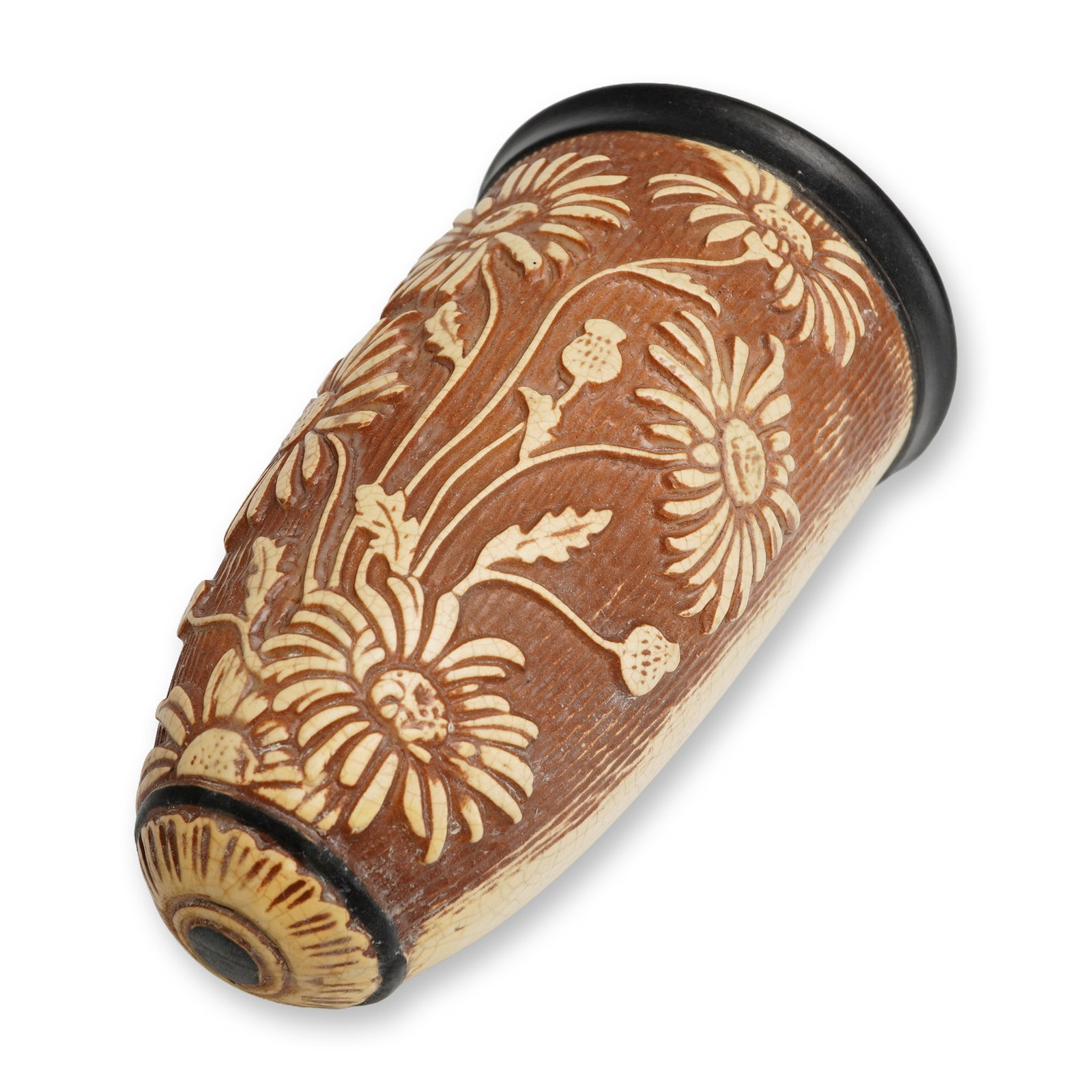 Weller Pottery Wall Pocket, Knifewood: Ceramic wall pocket of tapered, semi-ovoid form featuring a flat back with a single integrated mounting hole. The front is decorated with high-relief molded floral motifs, likely chrysanthemums or dai