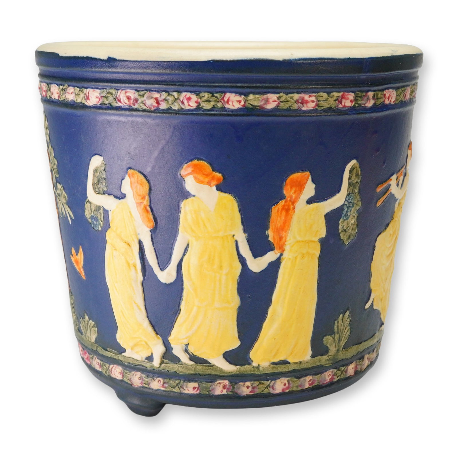 Weller Pottery Dancing Grecian Lady Jardiniere, Blue Ware: A Weller Pottery Blue Ware ceramic jardiniere featuring a matte cobalt blue ground with polychrome relief decoration. The central frieze depicts a continuous scene of classical Grecian female figures 